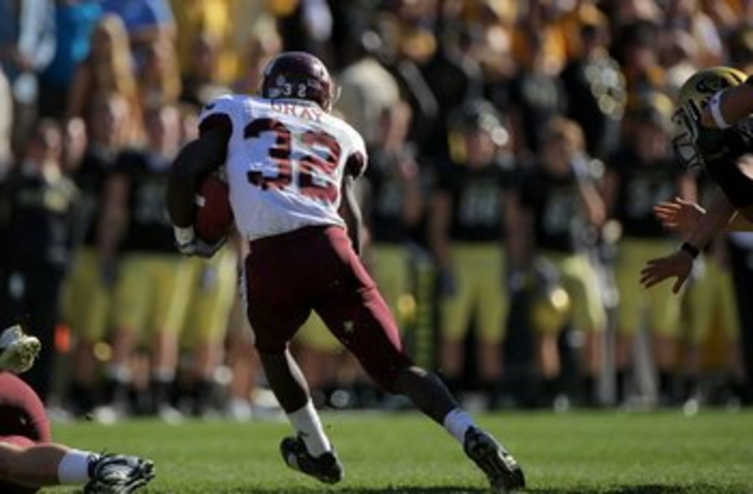 BOULDER, CO - NOVEMBER 07:  Cyrus Gray #32 of the Texas A&M Aggies returns a kick off for a touchdown against the Colorado Buffaloes during NCAA college football action at Folsom Field on November 7, 2009 in Boulder, Colorado. Colorado defeated Texas A&M 