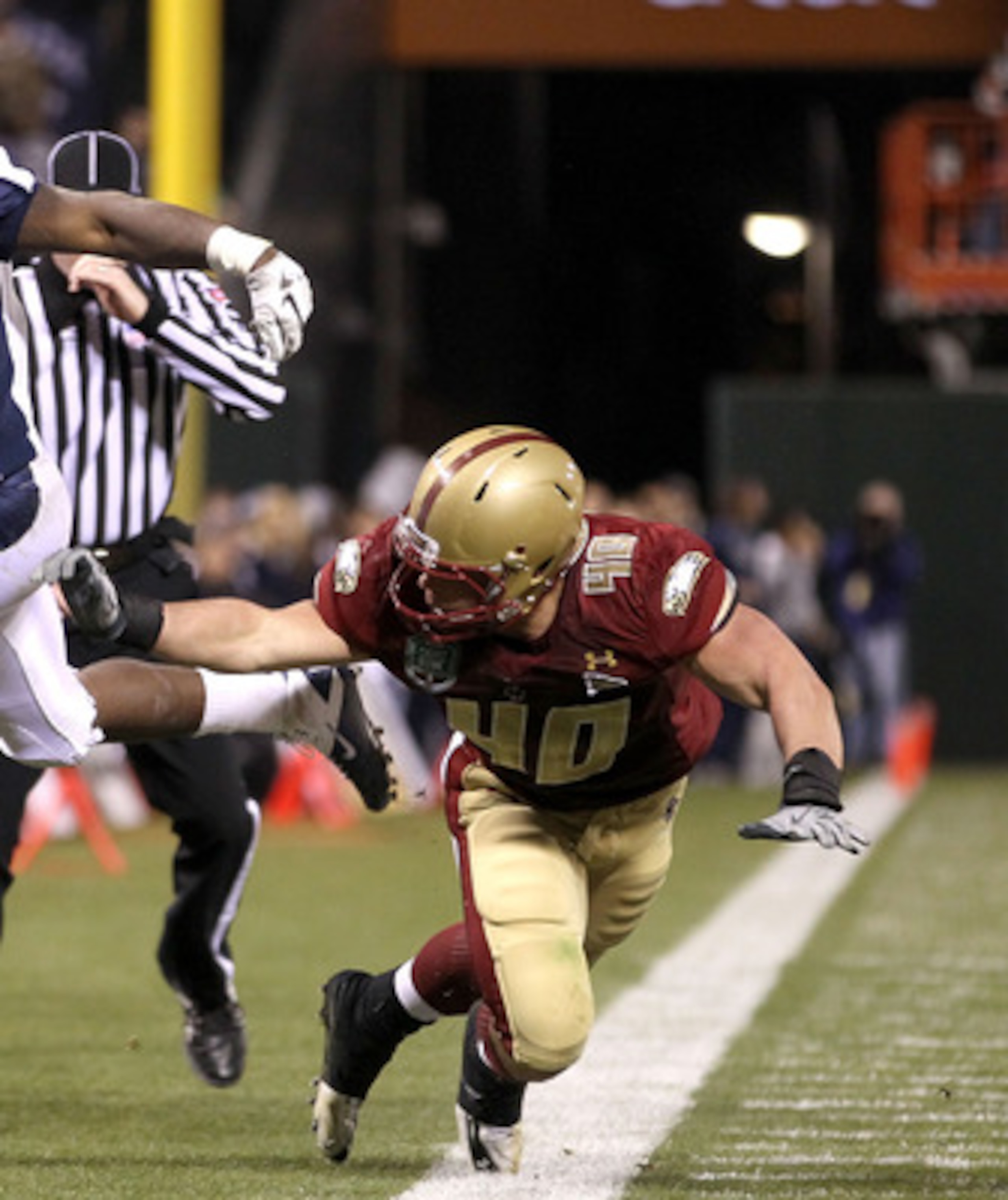 SAN FRANCISCO, CA - JANUARY 09: Mike Ball #5 of the Nevada Wolf Pack is pushed out of bounds by Luke Kuechly #40 of Boston College during the Kraft Fight Hunger Bowl at AT&T Park on January 9, 2011 in San Francisco, California. (Photo by Ezra Shaw/Getty SAN FRANCISCO, CA - JANUARY 09: Mike Ball #5 of the Nevada Wolf Pack is pushed out of bounds by Luke Kuechly #40 of Boston College during the Kraft Fight Hunger Bowl at AT&T Park on January 9, 2011 in San Francisco, California. (Photo by Ezra Shaw/Getty