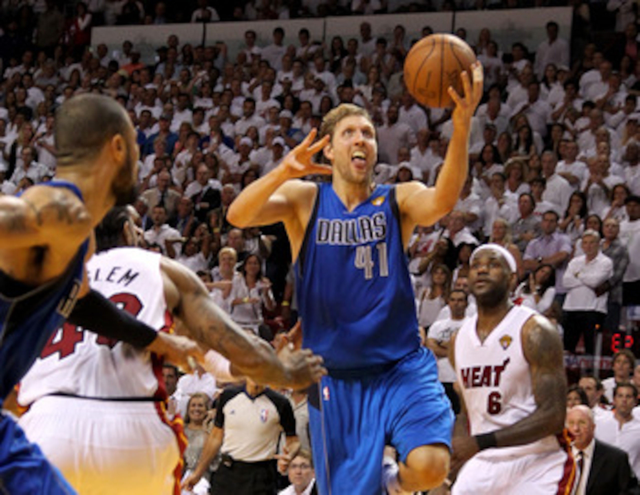 MIAMI, FL - JUNE 02:  Dirk Nowitzki #41 of the Dallas Mavericks makes the game-winning shot to put the Mavericks up 95-93 with 3.6 seconds left in the game against Udonis Haslem #40 of the Miami Heat in Game Two of the 2011 NBA Finals at American Airlines