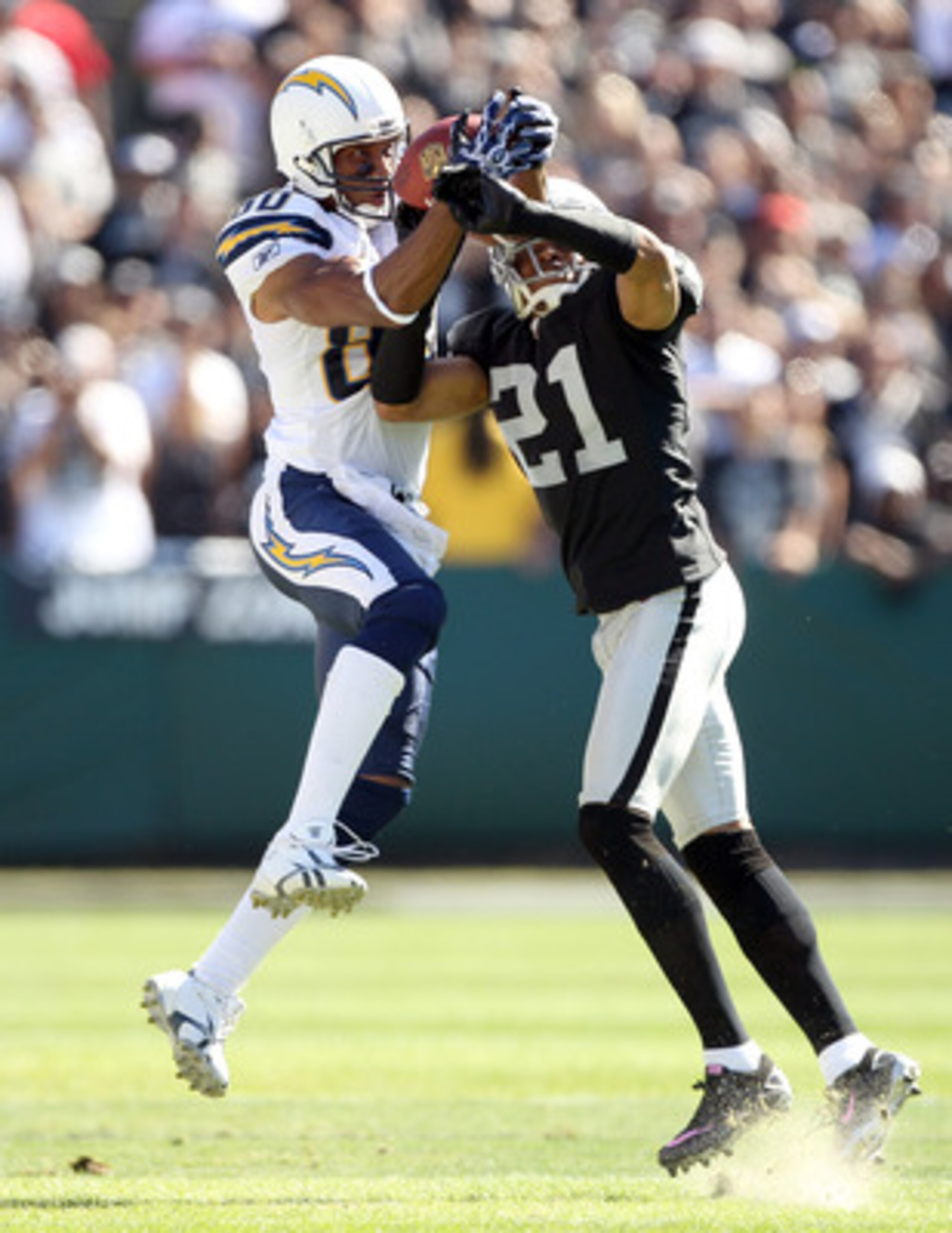 OAKLAND, CA - OCTOBER 10: Malcom Floyd #80 of the San Diego Chargers catches a ball while defended by Nnamdi Asomugha #21 of the Oakland Raiders at Oakland-Alameda County Coliseum on October 10, 2010 in Oakland, California. (Photo by Ezra Shaw/Getty Ima OAKLAND, CA - OCTOBER 10: Malcom Floyd #80 of the San Diego Chargers catches a ball while defended by Nnamdi Asomugha #21 of the Oakland Raiders at Oakland-Alameda County Coliseum on October 10, 2010 in Oakland, California. (Photo by Ezra Shaw/Getty Ima