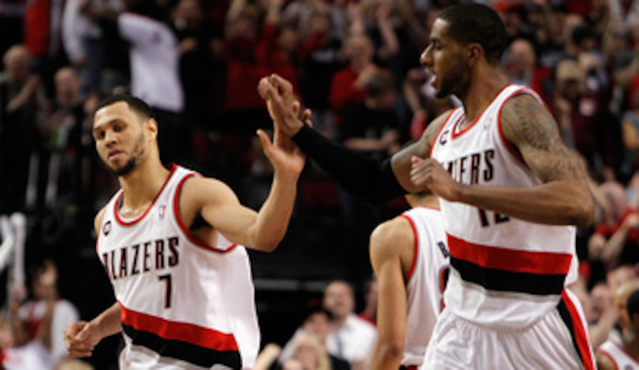 PORTLAND, OR - APRIL 23:  Brandon Roy #7 high fives LaMarcus Aldridge #12 of the Portland Trail Blazers against the Dallas Mavericks in Game Four of the Western Conference Quarterfinals in the 2011 NBA Playoffs on April 23, 2011 at the Rose Garden in Port