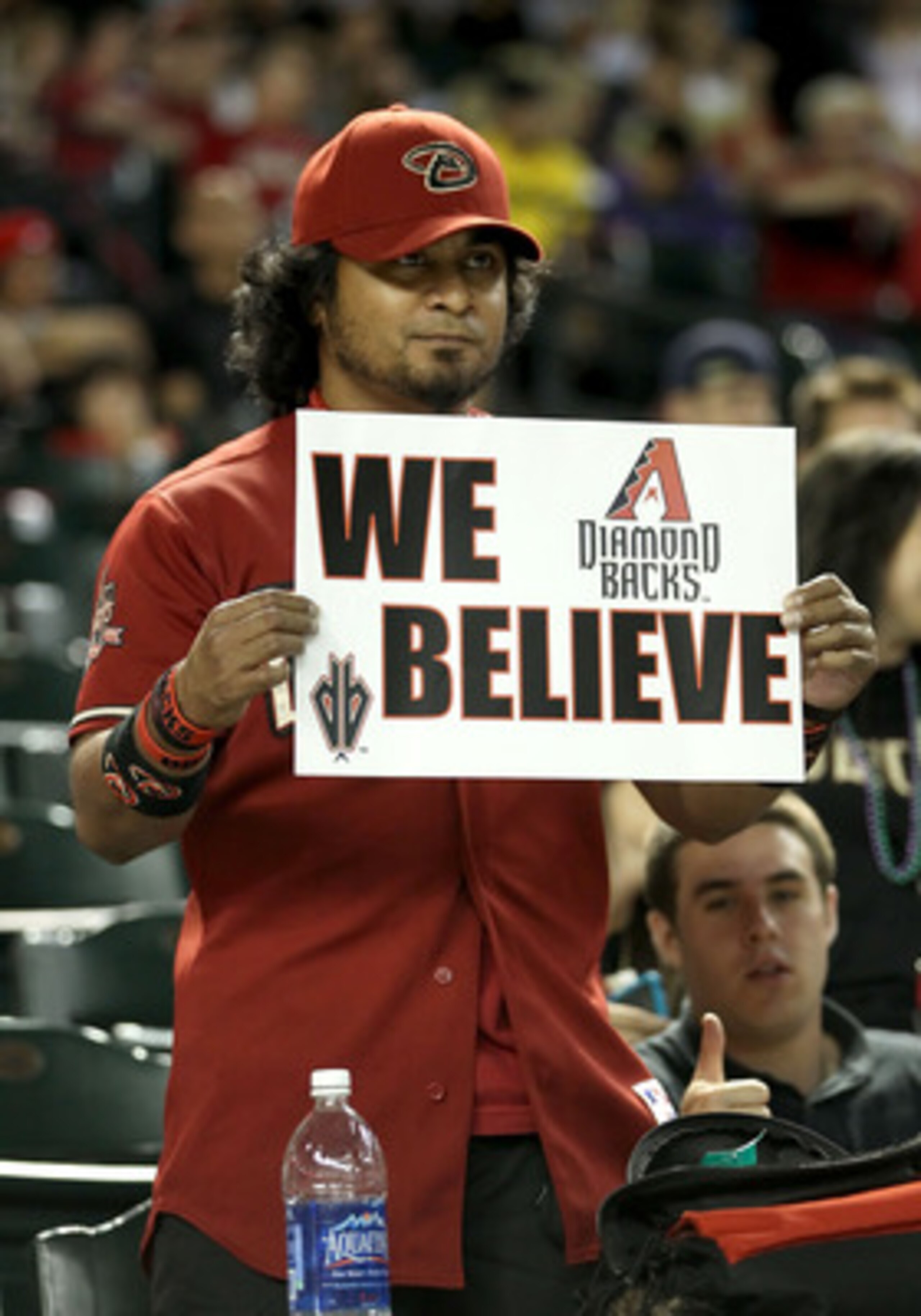 PHOENIX, AZ - JUNE 03: A fan of the Arizona Diamondbacks holds up a sign reading 'We Believe' during the Major League Baseball game against the Washington Nationals at Chase Field on June 3, 2011 in Phoenix, Arizona. The Diamondbacks defeated the National