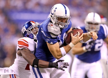INDIANAPOLIS - SEPTEMBER 19: Dallas Clark #44  of the Indianapolis Colts catches a pass while defended by Kenny Phillips #21 of the New York Giants during the NFL game at Lucas Oil Stadium on September 19, 2010 in Indianapolis, Indiana.  (Photo by Andy Ly