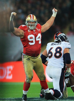LONDON, ENGLAND - OCTOBER 31:  Justin Smith #94 of San Francisco 49ers celebrates sacking Kyle Orton the Denver Broncos Quarterback during the NFL International Series match between Denver Broncos and San Francisco 49ers at Wembley Stadium on October 31,