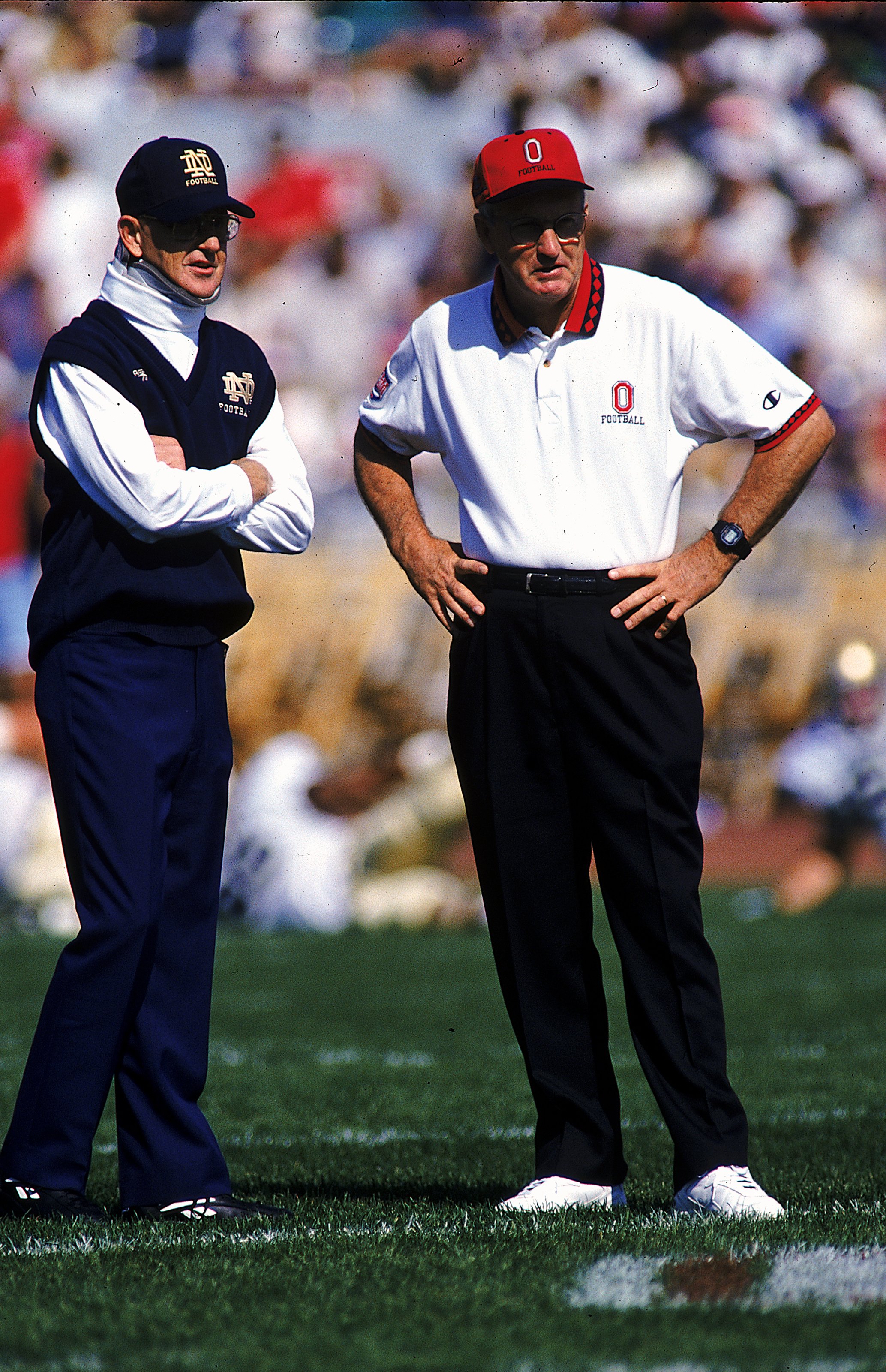 30 Sep 1995: Head coach Lou Holtz of the Notre Dame Fighting Irish stands with Head coach John Cooper of the Ohio State Buckeyes at the Ohio Stadium in Columbus, Ohio. The Buckeyes defeated the Fighting Irish 45-26. Mandatory Credit: Andy Lyons  /Allsport