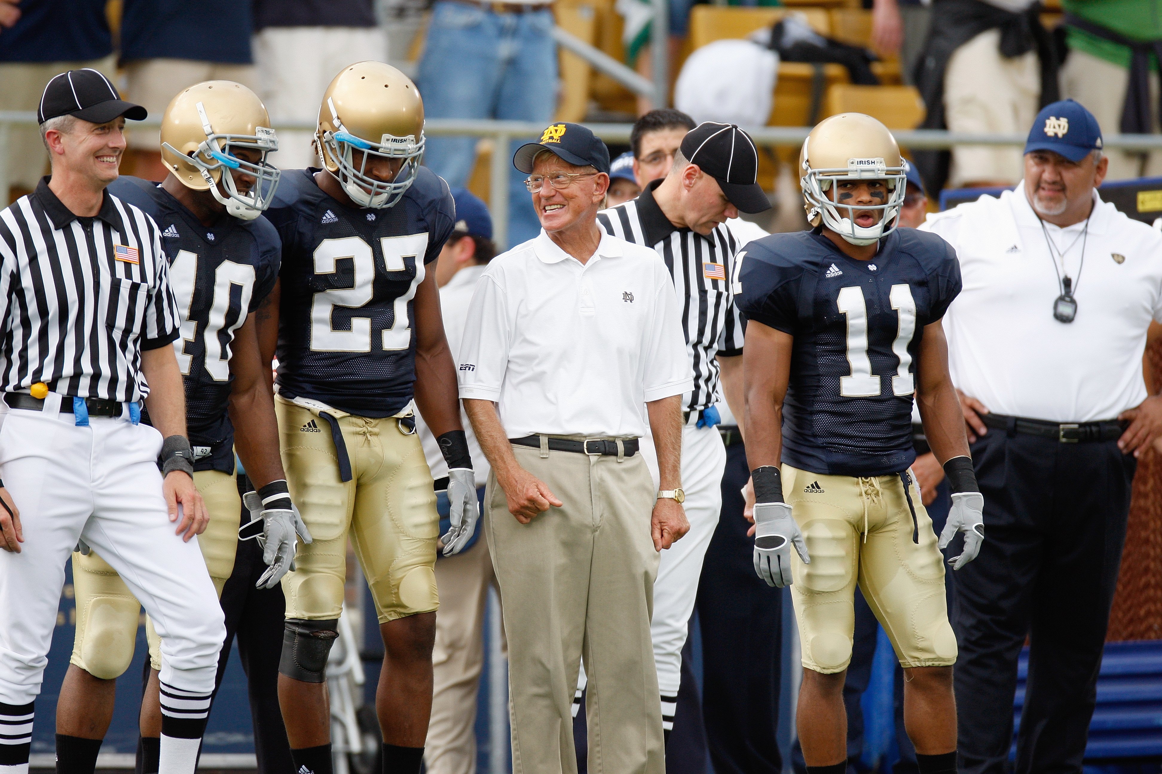 SOUTH BEND,IN - SEPTEMBER 13:  Former head coach Lou Holtz of the Notre Dame Fighting Irish stands with players before the game against the Michigan Wolverines on September 13, 2008 at Notre Dame Stadium in South Bend, Indiana. (Photo by: Gregory Shamus/G