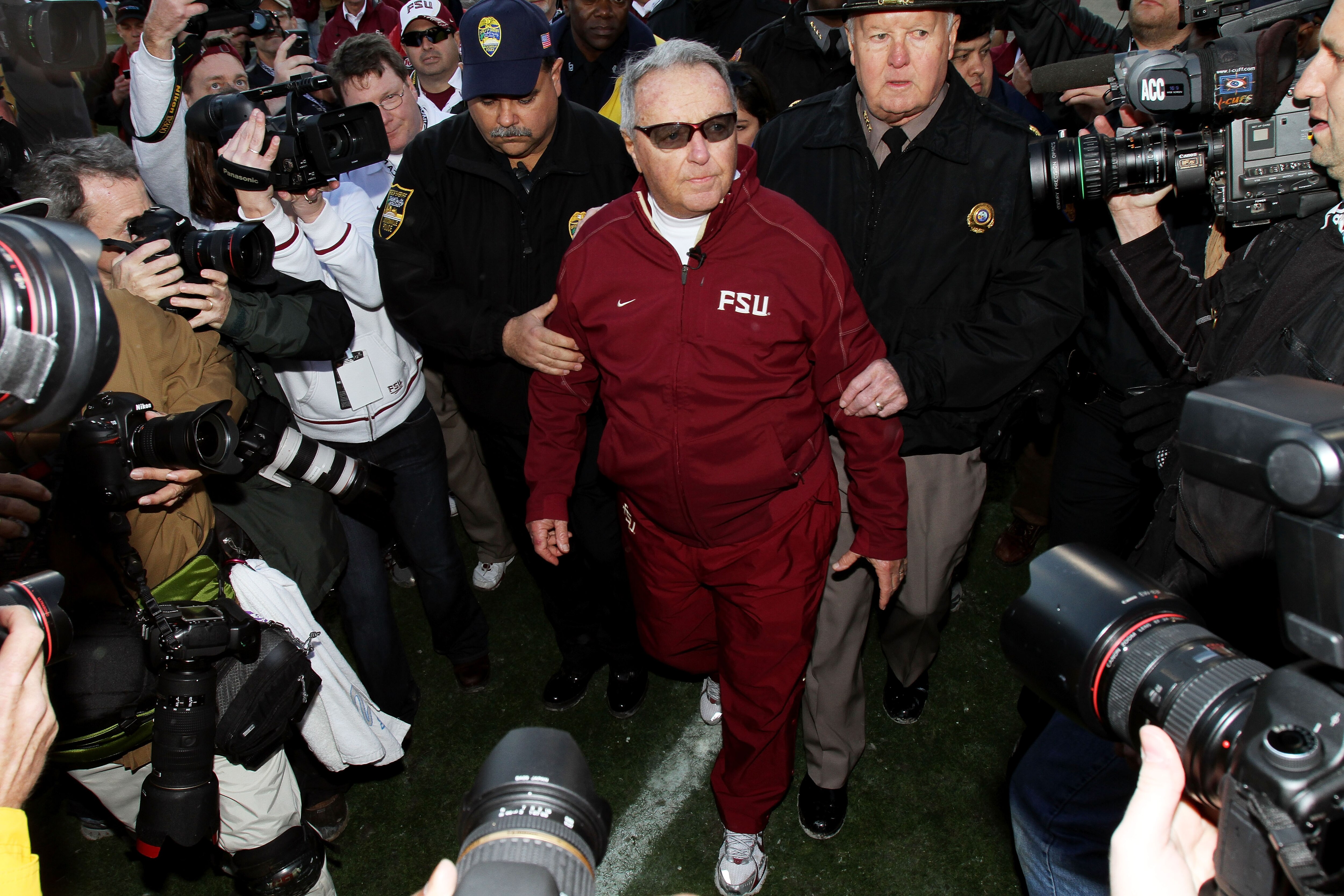 JACKSONVILLE, FL - JANUARY 01:  Head coach Bobby Bowden of the Florida State Seminoles is escorted off the field after defeating the West Virginia Mountaineers during the Konica Minolta Gator Bowl on January 1, 2010 at Jacksonville Municipal Stadium in Ja