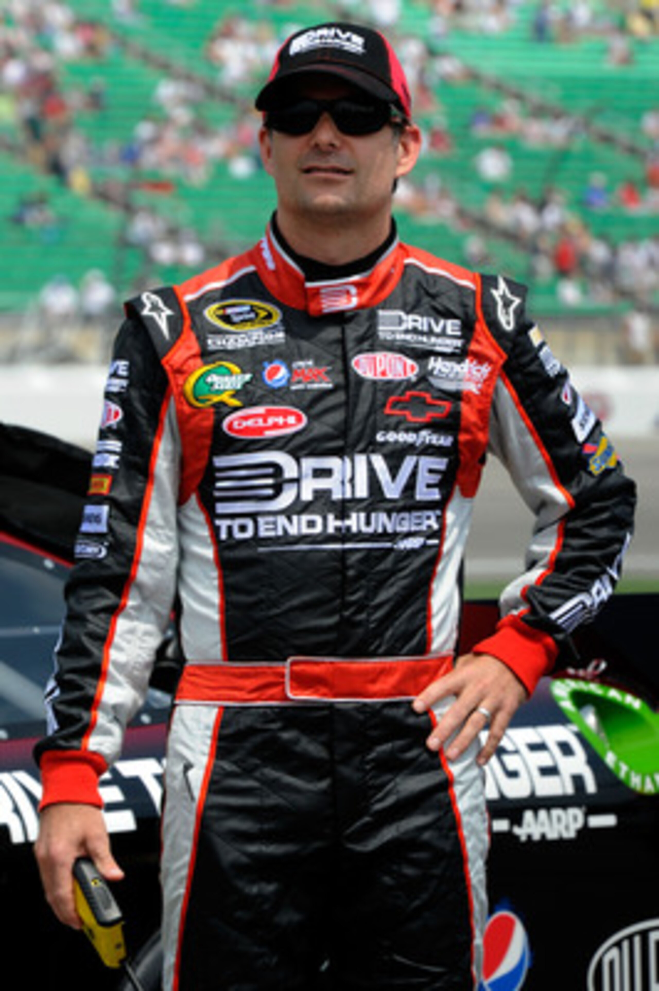 KANSAS CITY, KS - JUNE 04:  Jeff Gordon, driver of the #24 Drive to End Hunger Chevrolet, stands on the grid during qualifying for the NASCAR Sprint Cup Series STP 400 at Kansas Speedway on June 4, 2011 in Kansas City, Kansas.  (Photo by John Harrelson/Ge