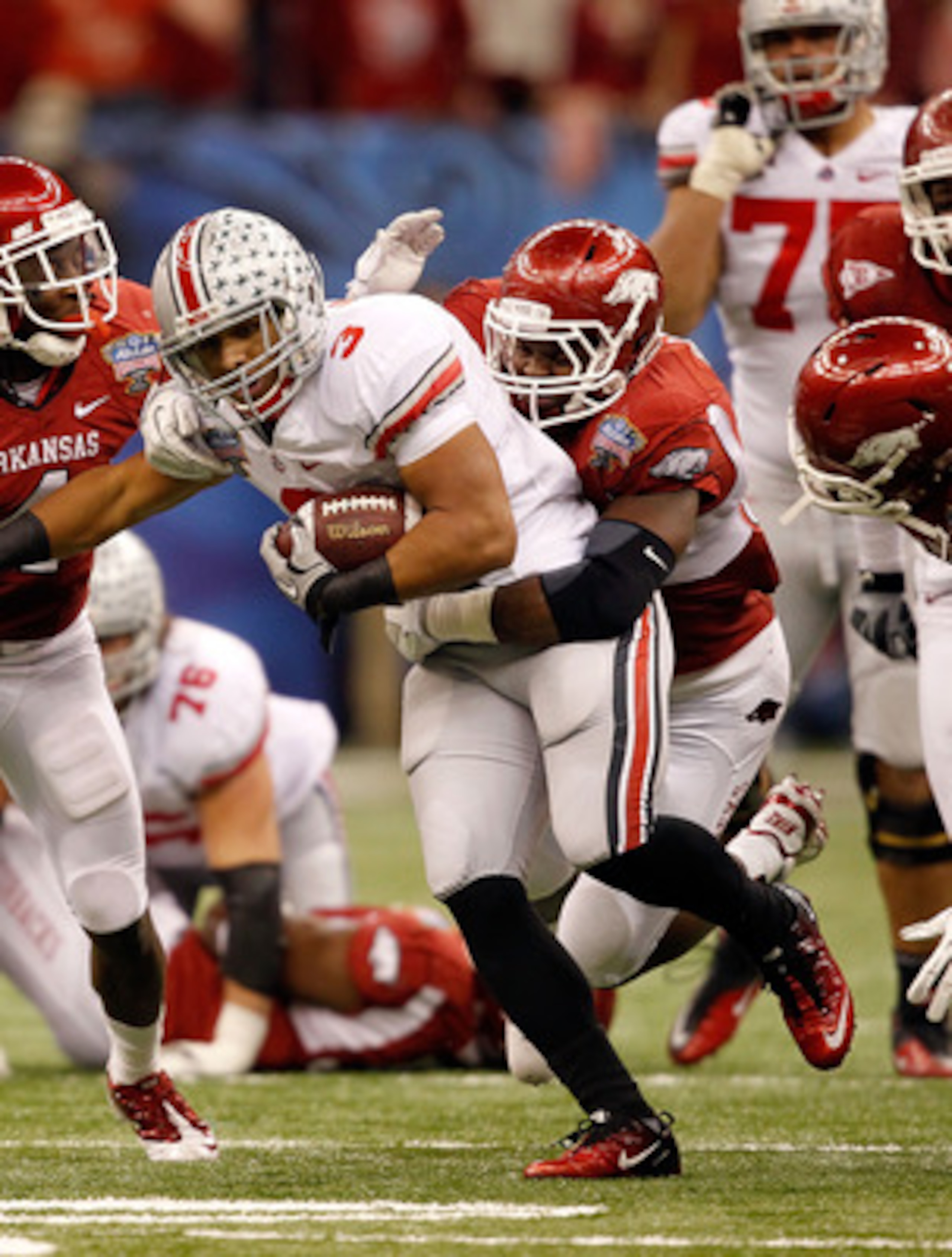 NEW ORLEANS, LA - JANUARY 04: Brandon Saine #3 of the Ohio State Buckeyes makes a move after a catch against Jerry Franklin #34 of the Arkansas Razorbacks during the Allstate Sugar Bowl at the Louisiana Superdome on January 4, 2011 in New Orleans, Louisi NEW ORLEANS, LA - JANUARY 04: Brandon Saine #3 of the Ohio State Buckeyes makes a move after a catch against Jerry Franklin #34 of the Arkansas Razorbacks during the Allstate Sugar Bowl at the Louisiana Superdome on January 4, 2011 in New Orleans, Louisi