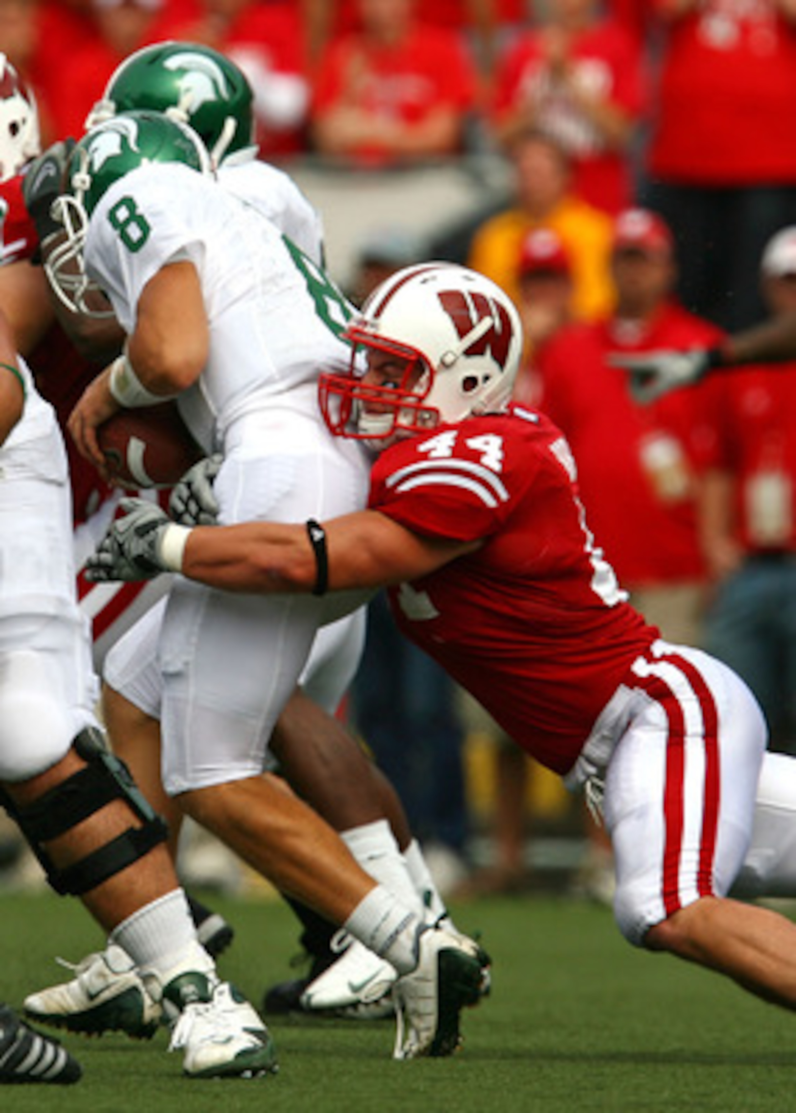 MADISON, WI - SEPTEMBER 26: Chris Borland #44 of the Wisconsin Badgers sacks Kirk Cousins #8 of the Michigan State Spartans on September 26, 2009 at Camp Randall Stadium in Madison, Wisconsin. Wisconsin defeated Michigan State 38-30. (Photo by Jonathan Da MADISON, WI - SEPTEMBER 26: Chris Borland #44 of the Wisconsin Badgers sacks Kirk Cousins #8 of the Michigan State Spartans on September 26, 2009 at Camp Randall Stadium in Madison, Wisconsin. Wisconsin defeated Michigan State 38-30. (Photo by Jonathan Da