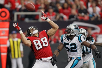 ATLANTA, GA - JANUARY 02:  Tony Gonzalez #88 of the Atlanta Falcons has this touchdown reception broken up by Jon Beason #52 of the Carolina Panthers at Georgia Dome on January 2, 2011 in Atlanta, Georgia.  (Photo by Kevin C. Cox/Getty Images)