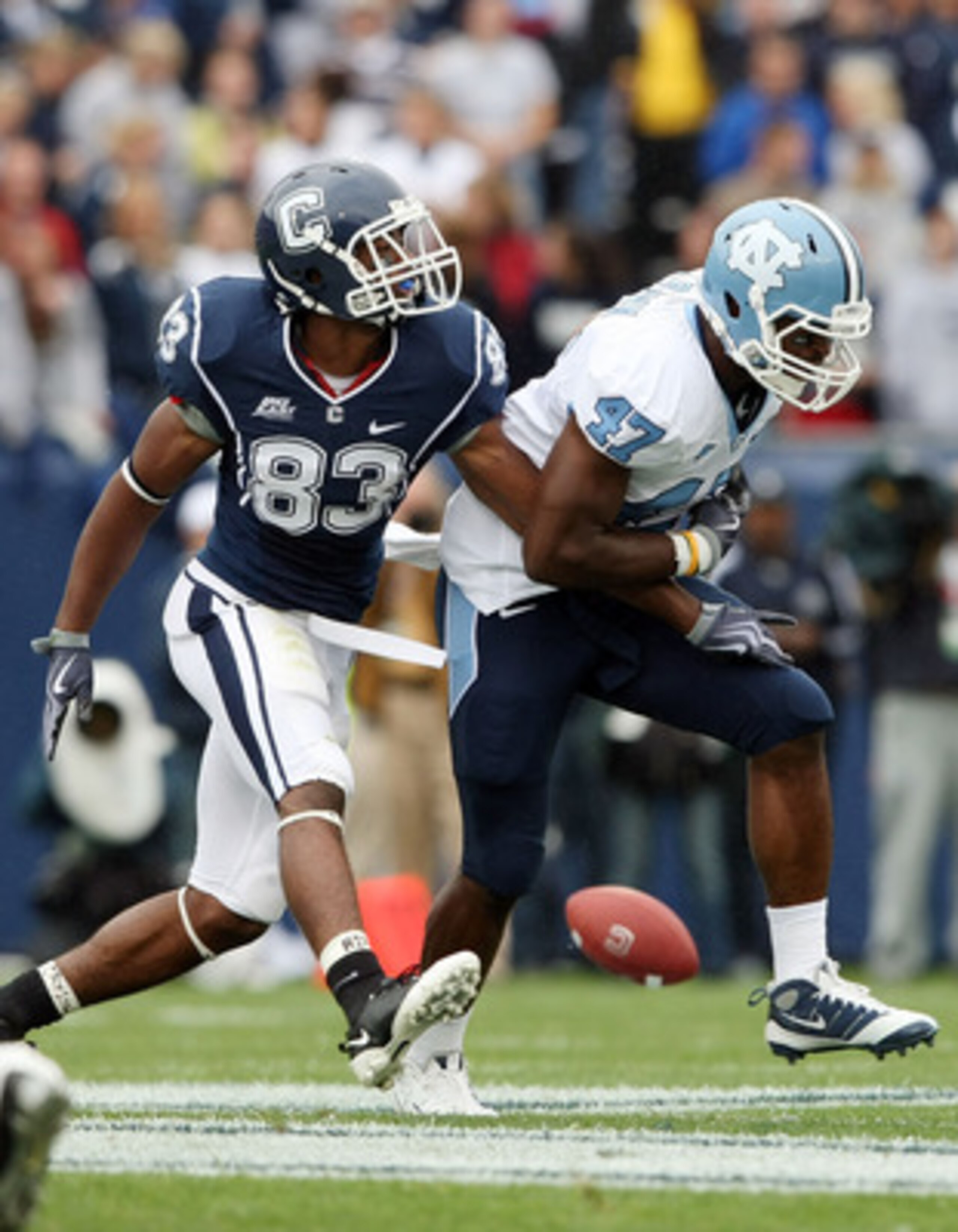 EAST HARTFORD, CT - SEPTEMBER 12: Zach Brown #47 of the North Carolinia Tar Heels breaks up a pass intended for Isiah Moore #83 of the Connecticut Huskies on September 12, 2009 at Rentschler Field in East Hartford, Connecticut. (Photo by Elsa/Getty Imag EAST HARTFORD, CT - SEPTEMBER 12: Zach Brown #47 of the North Carolinia Tar Heels breaks up a pass intended for Isiah Moore #83 of the Connecticut Huskies on September 12, 2009 at Rentschler Field in East Hartford, Connecticut. (Photo by Elsa/Getty Imag