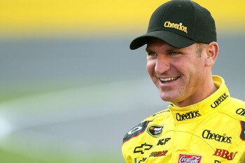 CHARLOTTE, NC - MAY 26:  Clint Bowyer, driver of the #33 Cheerios/Hamburger Helper Chevrolet, walks on the grid during qualifying for the NASCAR Sprint Cup Series Coca-Cola 600 at Charlotte Motor Speedway on May 26, 2011 in Charlotte, North Carolina.  (Ph