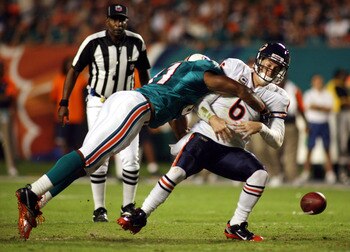 MIAMI - NOVEMBER 18:  Quarterback Jay Cutler #6 of the Chicago Bears is sacked by linebacker Cameron wake #91 of the Miami Dolphins and fumbles at Sun Life Stadium on November 18, 2010 in Miami, Florida.  (Photo by Marc Serota/Getty Images)