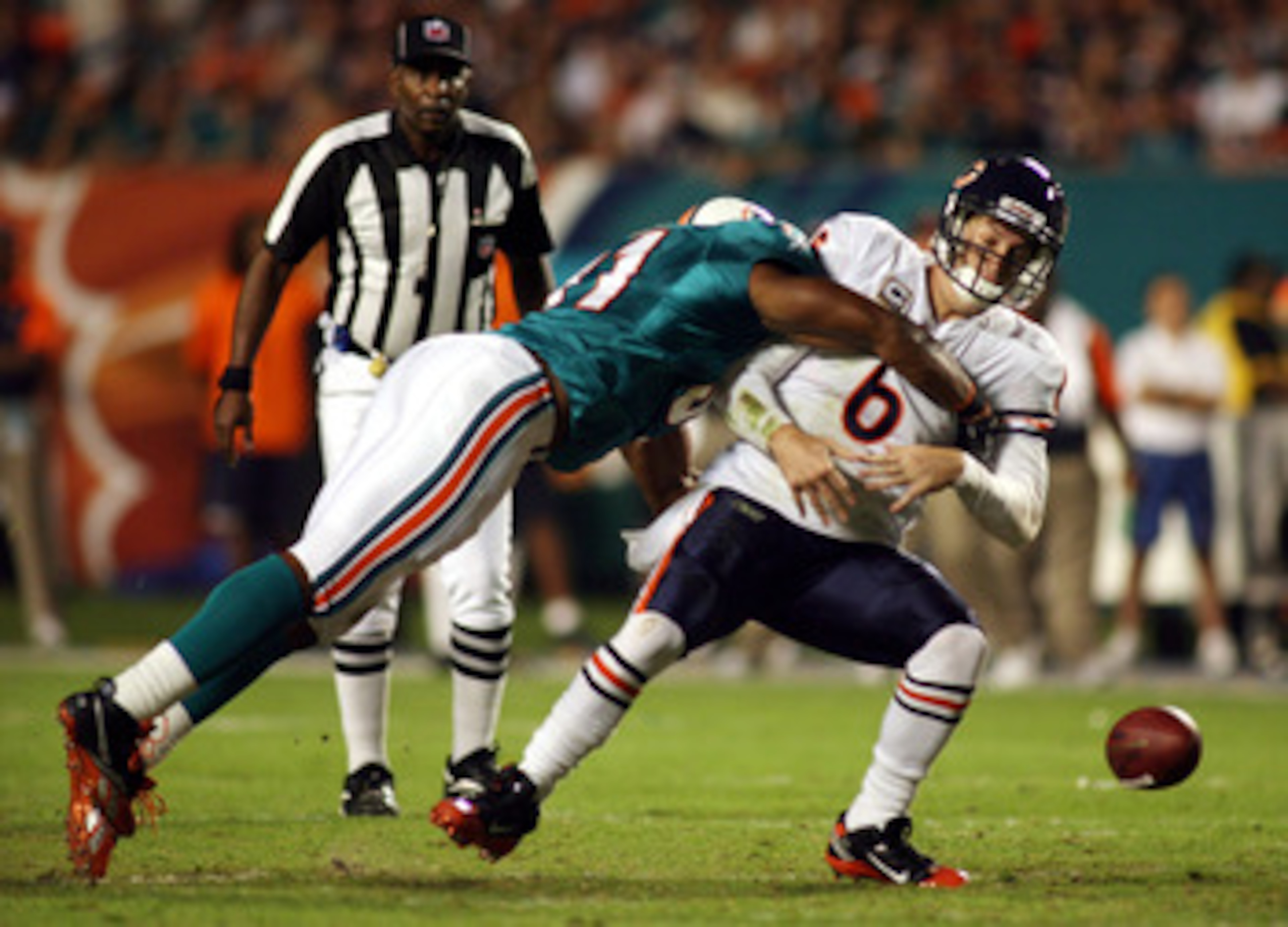 MIAMI - NOVEMBER 18:  Quarterback Jay Cutler #6 of the Chicago Bears is sacked by linebacker Cameron wake #91 of the Miami Dolphins and fumbles at Sun Life Stadium on November 18, 2010 in Miami, Florida.  (Photo by Marc Serota/Getty Images)