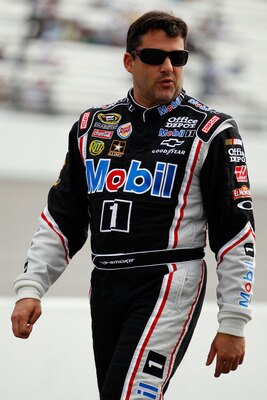 RICHMOND, VA - APRIL 29:  Tony Stewart, driver of the #14 Mobil 1/Office Depot Chevrolet, walks on pit road during qualifying for the NASCAR Sprint Cup Series Crown Royal Presents The Matthew & Daniel Hansen 400 at Richmond International Raceway on April 