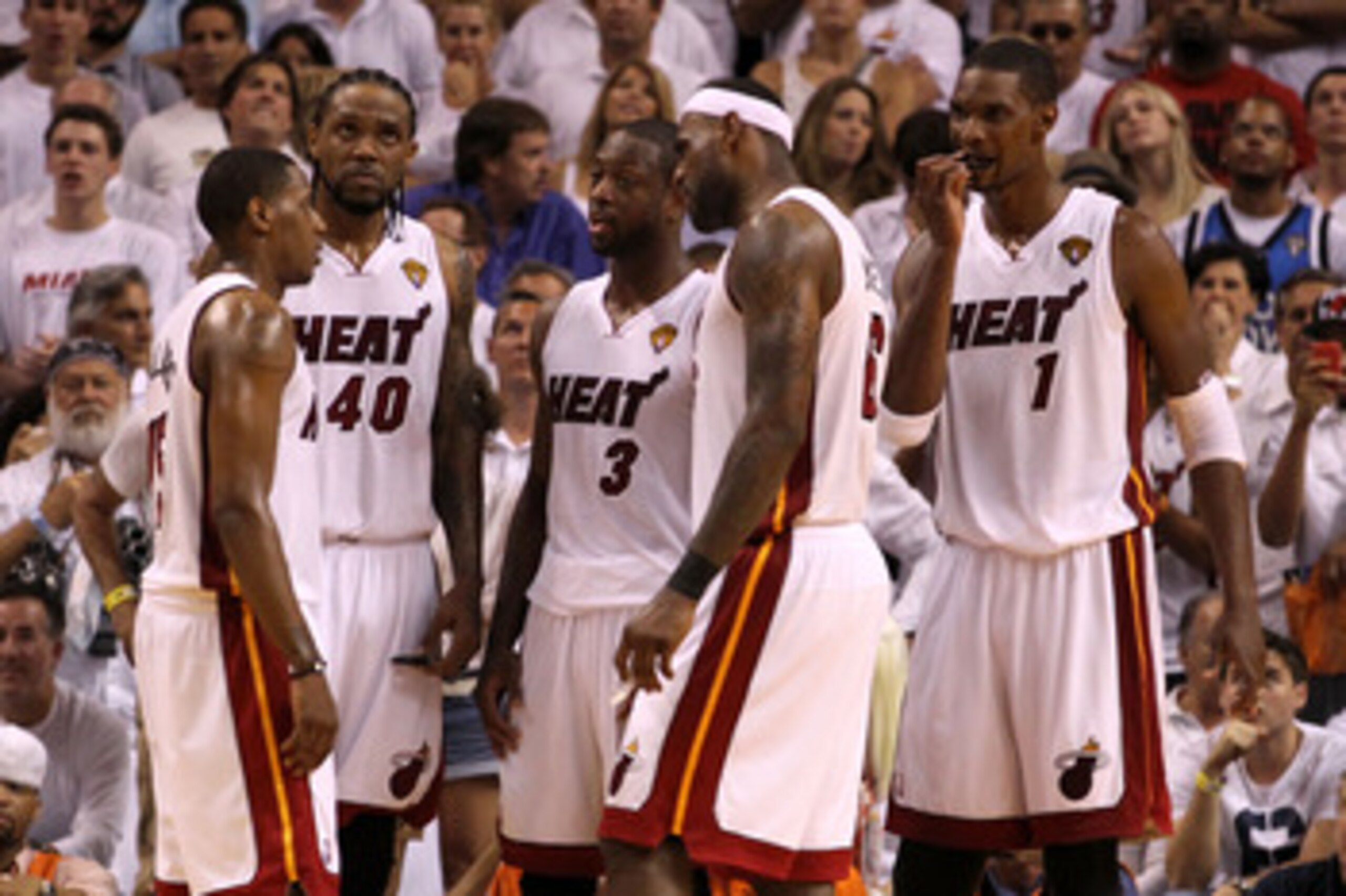 MIAMI, FL - JUNE 02:  (L-R) Mario Chalmers #15, Udonis Haslem #40, Dwyane Wade #3, LeBron James #6 and Chris Bosh #1 of the Miami Heat talk on court against the Dallas Mavericks in Game Two of the 2011 NBA Finals at American Airlines Arena on June 2, 2011
