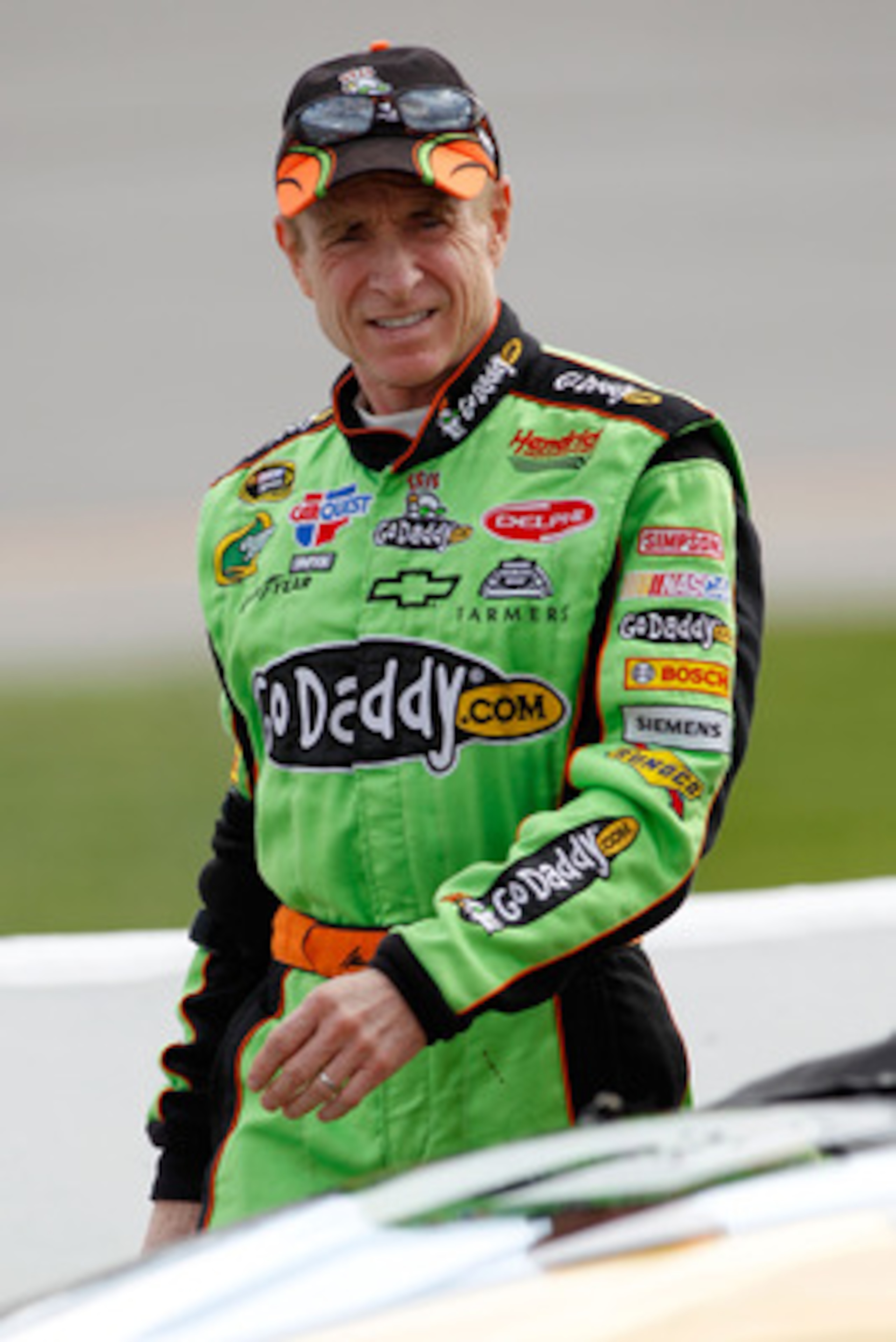 RICHMOND, VA - APRIL 29:  Mark Martin, driver of the #5 GoDaddy.com Chevrolet, walks on pit road during qualifying for the NASCAR Sprint Cup Series Crown Royal Presents The Matthew & Daniel Hansen 400 at Richmond International Raceway on April 29, 2011 in