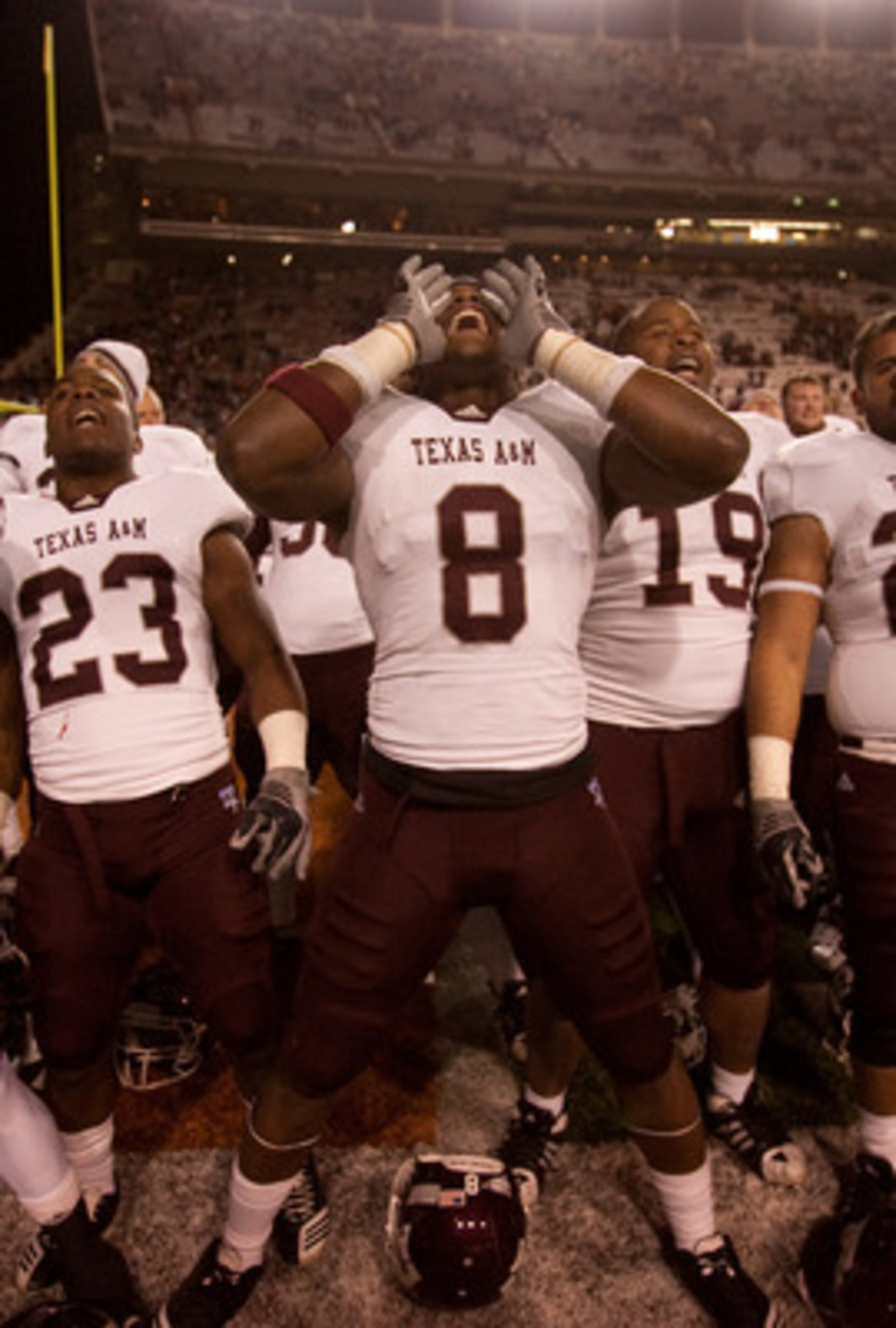 AUSTIN, TX - NOVEMBER 25: Texas A&M players (L-R) Dustin Harris #22, Ben Malena #23, Jeff Fuller #8, Michael Lamothe #19, Blane Cheatham #29, and C.J. Jones #27 celebrate Texas A&M's 24-17 win over the University of Texas at Darrell K. Royal-Texas Memori AUSTIN, TX - NOVEMBER 25: Texas A&M players (L-R) Dustin Harris #22, Ben Malena #23, Jeff Fuller #8, Michael Lamothe #19, Blane Cheatham #29, and C.J. Jones #27 celebrate Texas A&M's 24-17 win over the University of Texas at Darrell K. Royal-Texas Memori