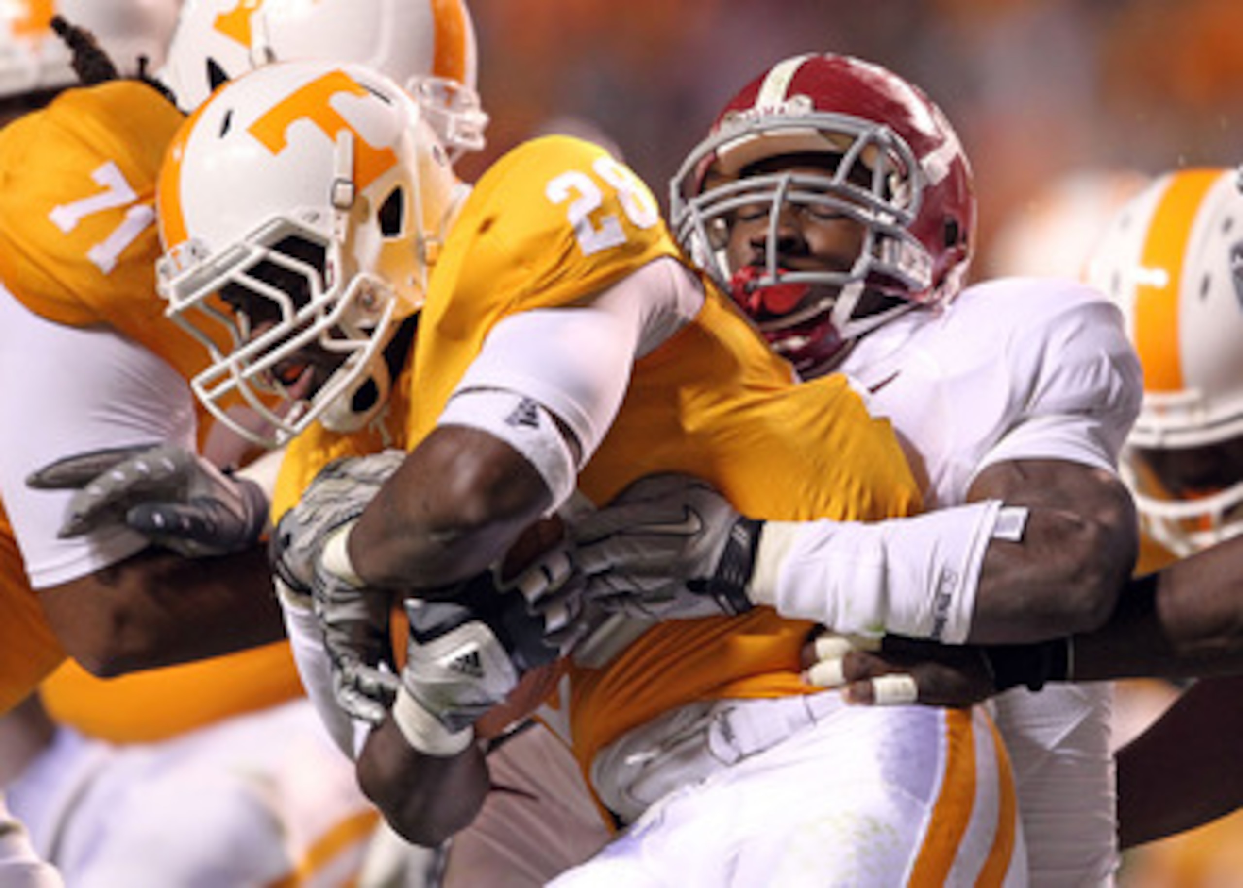KNOXVILLE, TN - OCTOBER 23: Tauren Poole #28 of the Tennessee Volunteers runs with the ball dwhile tackled by C.J. Mosley #32 of the Alabama Crimson Tide at Neyland Stadium on October 23, 2010 in Knoxville, Tennessee. (Photo by Andy Lyons/Getty Images) KNOXVILLE, TN - OCTOBER 23: Tauren Poole #28 of the Tennessee Volunteers runs with the ball dwhile tackled by C.J. Mosley #32 of the Alabama Crimson Tide at Neyland Stadium on October 23, 2010 in Knoxville, Tennessee. (Photo by Andy Lyons/Getty Images)