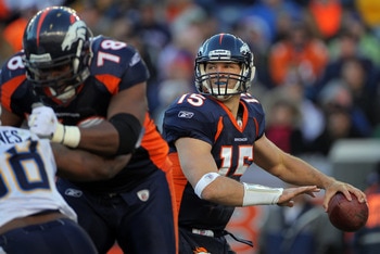 DENVER - JANUARY 02:  Quarterback Tim Tebow #15 of the Denver Broncos looks to deliver a pass behind the protection of offensive lineman Ryan Clady #78 as he blocks Antwan Barnes #98 of the San Diego Chargers at INVESCO Field at Mile High on January 2, 20