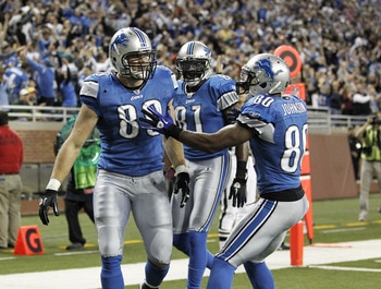 DETROIT, MI - DECEMBER 12:  Will Heller #89 of the Detroit Lions celebrates a for a fourth quarter touchdown with Bryant Johnson #80 and Calvin Johnson #81 while playing the Green Bay Packers on December 12, 2010 at Ford Field in Detroit, Michigan. Detroi
