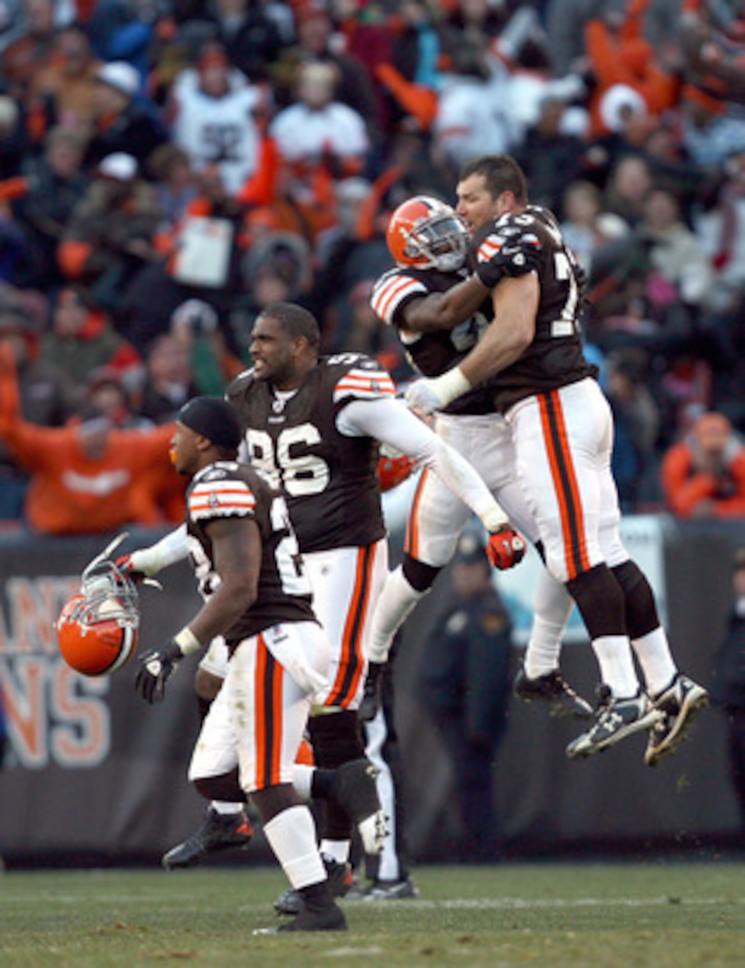 CLEVELAND - NOVEMBER 28:  Defensive players Clifton Smith #28, David Bowens #96, T.J. Ward #43 and Joe Thomas #73 of the Cleveland Browns celebrate after their game against the Carolina Panthers at Cleveland Browns Stadium on November 28, 2010 in Clevelan