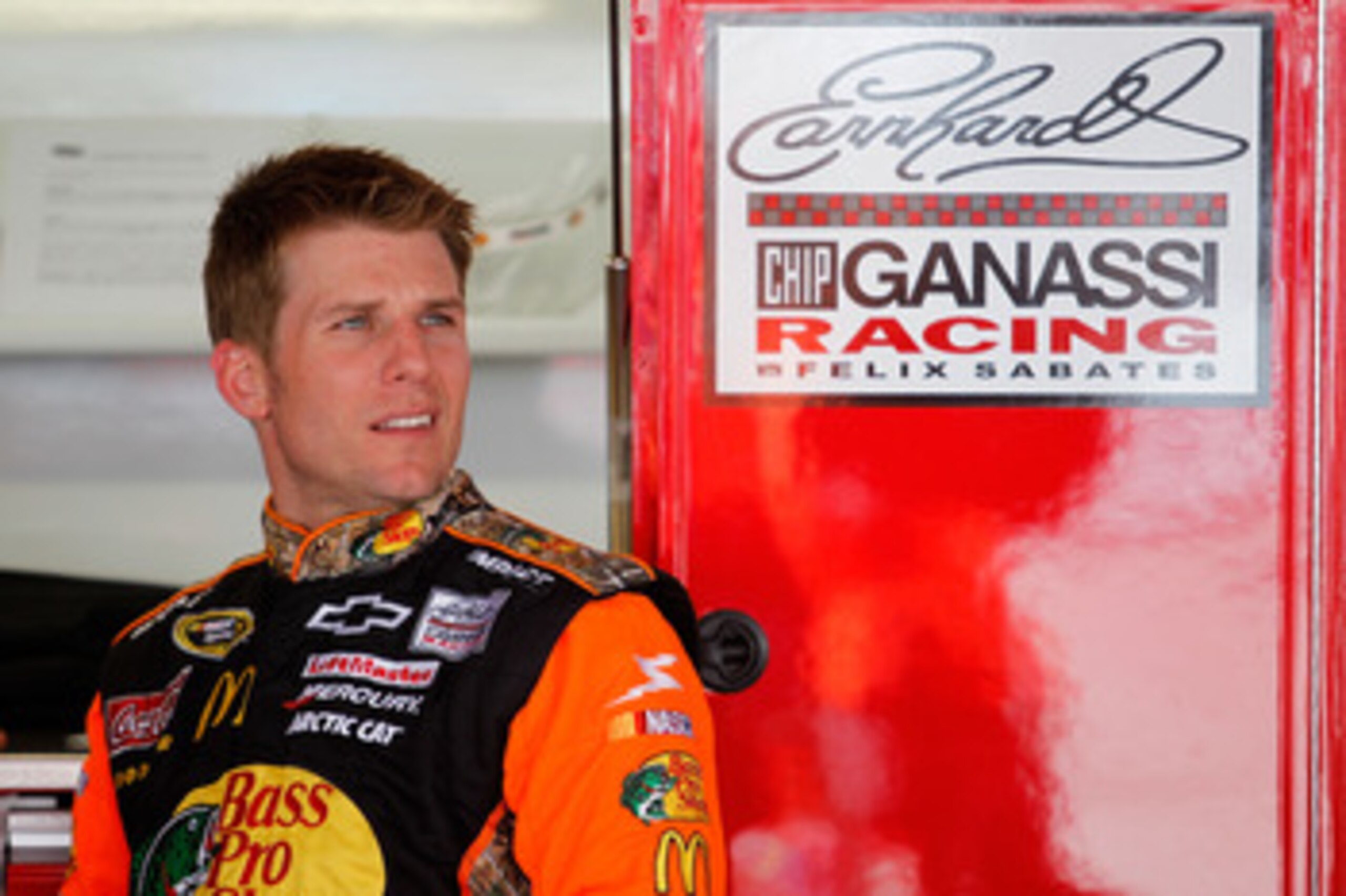 DOVER, DE - MAY 13:  Jamie McMurray, driver of the #1 Bass Pro Shops/Tracker Chevrolet, stands in the garage during practice for the NASCAR Sprint Cup Series FedEx 400 Benefiting Autism Speaks at Dover International Speedway on May 13, 2011 in Dover, Dela