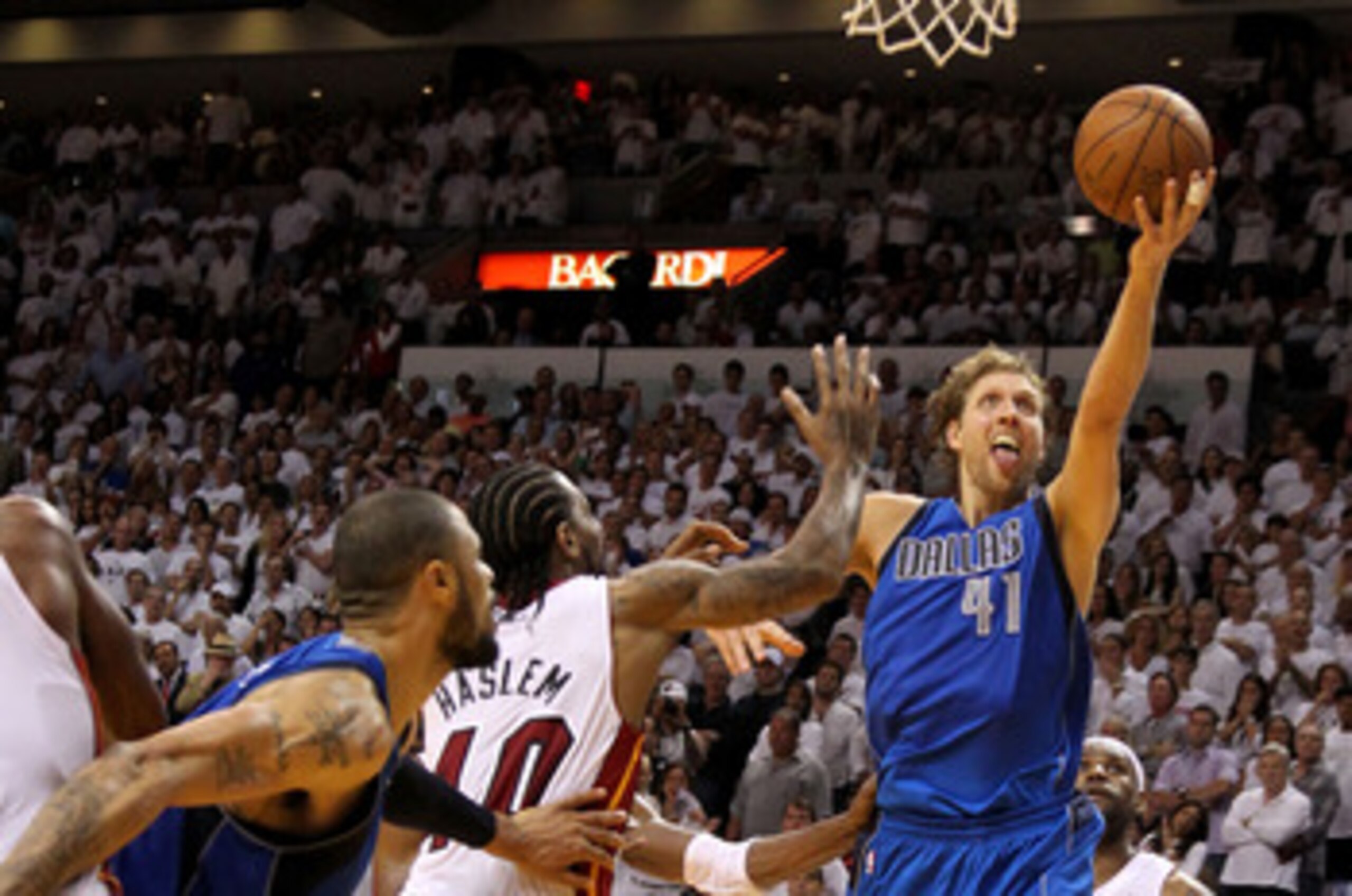MIAMI, FL - JUNE 02:  Dirk Nowitzki #41 of the Dallas Mavericks makes the game-winning shot to put the Mavericks up 95-93 with 3.6 seconds left in the game against Udonis Haslem #40 of the Miami Heat in Game Two of the 2011 NBA Finals at American Airlines