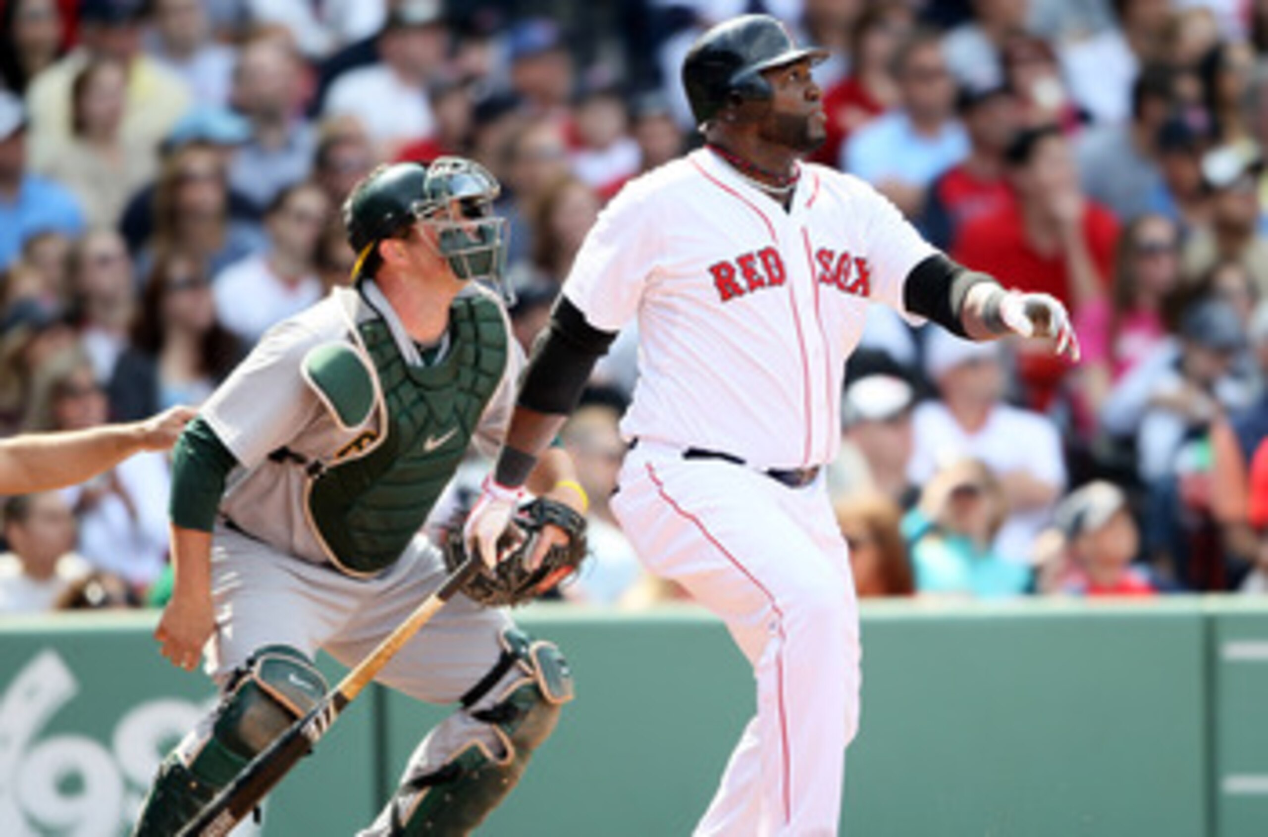 BOSTON, MA - JUNE 04: David Ortiz #34 of the Boston Red Sox hits a double in the eighth inning as Landon Powell #11 of the Oakland Athletics catches on June 4, 2011 at Fenway Park in Boston, Massachusetts. (Photo by Elsa/Getty Images) BOSTON, MA - JUNE 04: David Ortiz #34 of the Boston Red Sox hits a double in the eighth inning as Landon Powell #11 of the Oakland Athletics catches on June 4, 2011 at Fenway Park in Boston, Massachusetts. (Photo by Elsa/Getty Images)