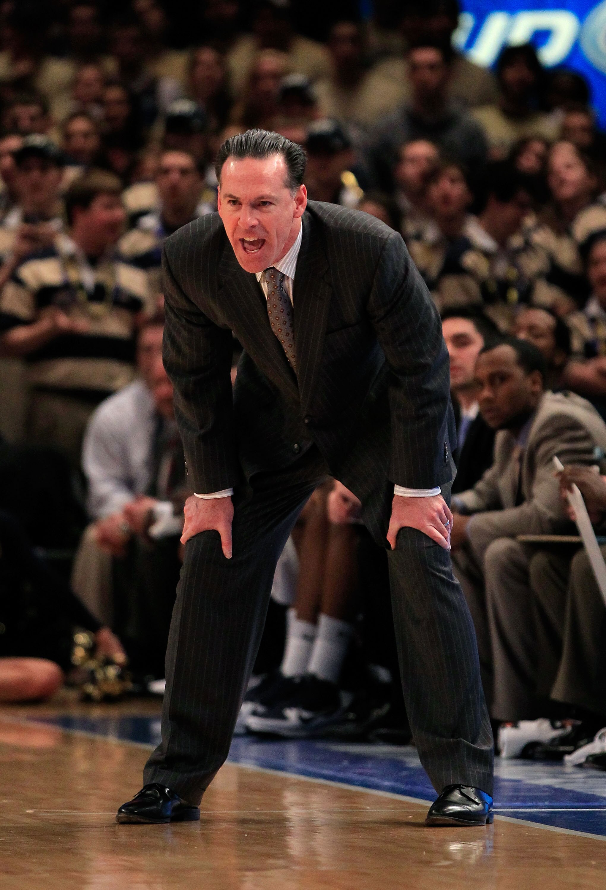 NEW YORK, NY - MARCH 10: head coach Jamie Dixon of the Pittsburgh Panthers looks on from the bench against the Connecticut Huskies during the quarterfinals of the 2011 Big East Men's Basketball Tournament presented by American Eagle Outfitters  at Madison