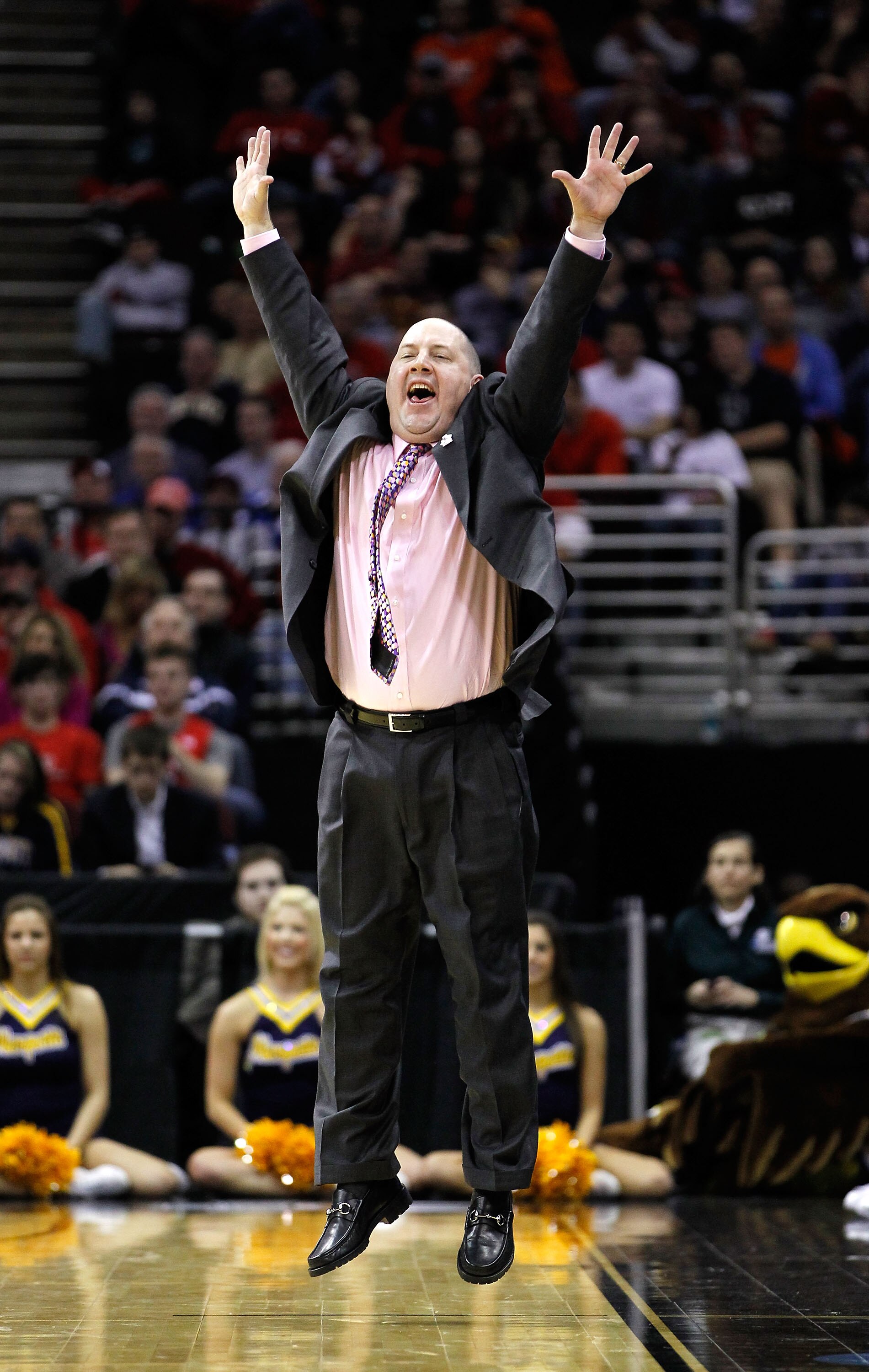 CLEVELAND, OH - MARCH 20:  Head coach Buzz Williams of the Marquette Golden Eagles looks on from the bench during the game against the Marquette Golden Eagles during the third of the 2011 NCAA men's basketball tournament at Quicken Loans Arena on March 20