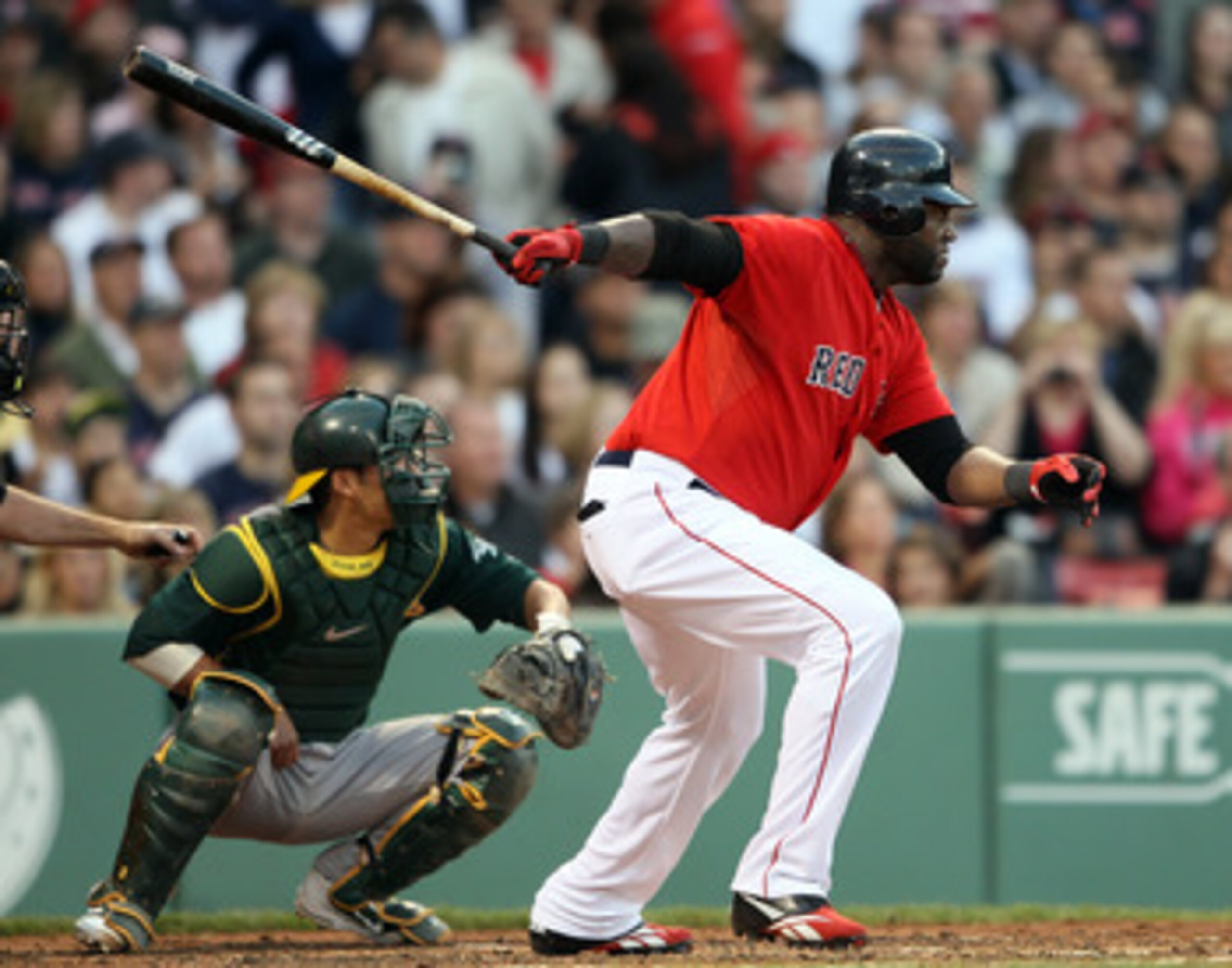 BOSTON, MA - JUNE 03: David Ortiz #34 of the Boston Red Sox gets a hit in the first inning as Kurt Suzuki #8 of the Oakland Athletics defends on June 3, 2011 at Fenway Park in Boston, Massachusetts. (Photo by Elsa/Getty Images) BOSTON, MA - JUNE 03: David Ortiz #34 of the Boston Red Sox gets a hit in the first inning as Kurt Suzuki #8 of the Oakland Athletics defends on June 3, 2011 at Fenway Park in Boston, Massachusetts. (Photo by Elsa/Getty Images)