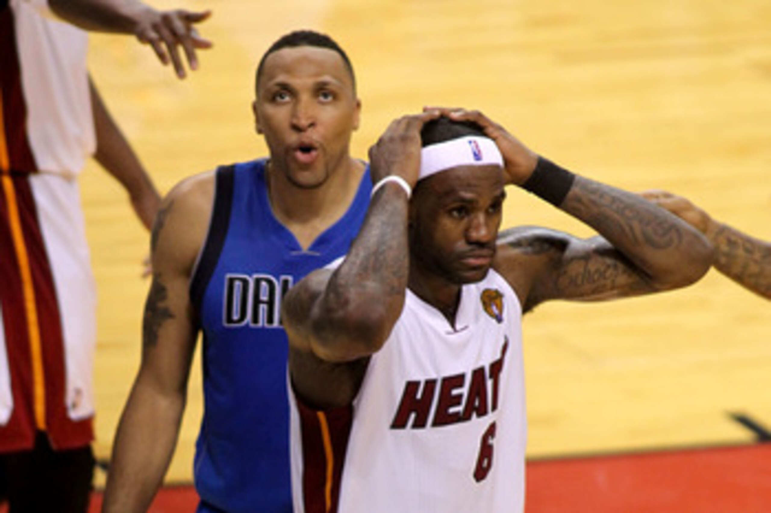 MIAMI, FL - JUNE 02:  LeBron James #6 of the Miami Heat reacts as Shawn Marion #0 of the Dallas Mavericks looks on in Game Two of the 2011 NBA Finals at American Airlines Arena on June 2, 2011 in Miami, Florida. The Mavericks won 95-93. NOTE TO USER: User