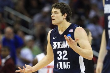 NEW ORLEANS, LA - MARCH 24:  Jimmer Fredette #32 of the Brigham Young Cougars reacts after being injured during their game against the Florida Gators in the Southeast regional of the 2011 NCAA men's basketball tournament at New Orleans Arena on March 24,