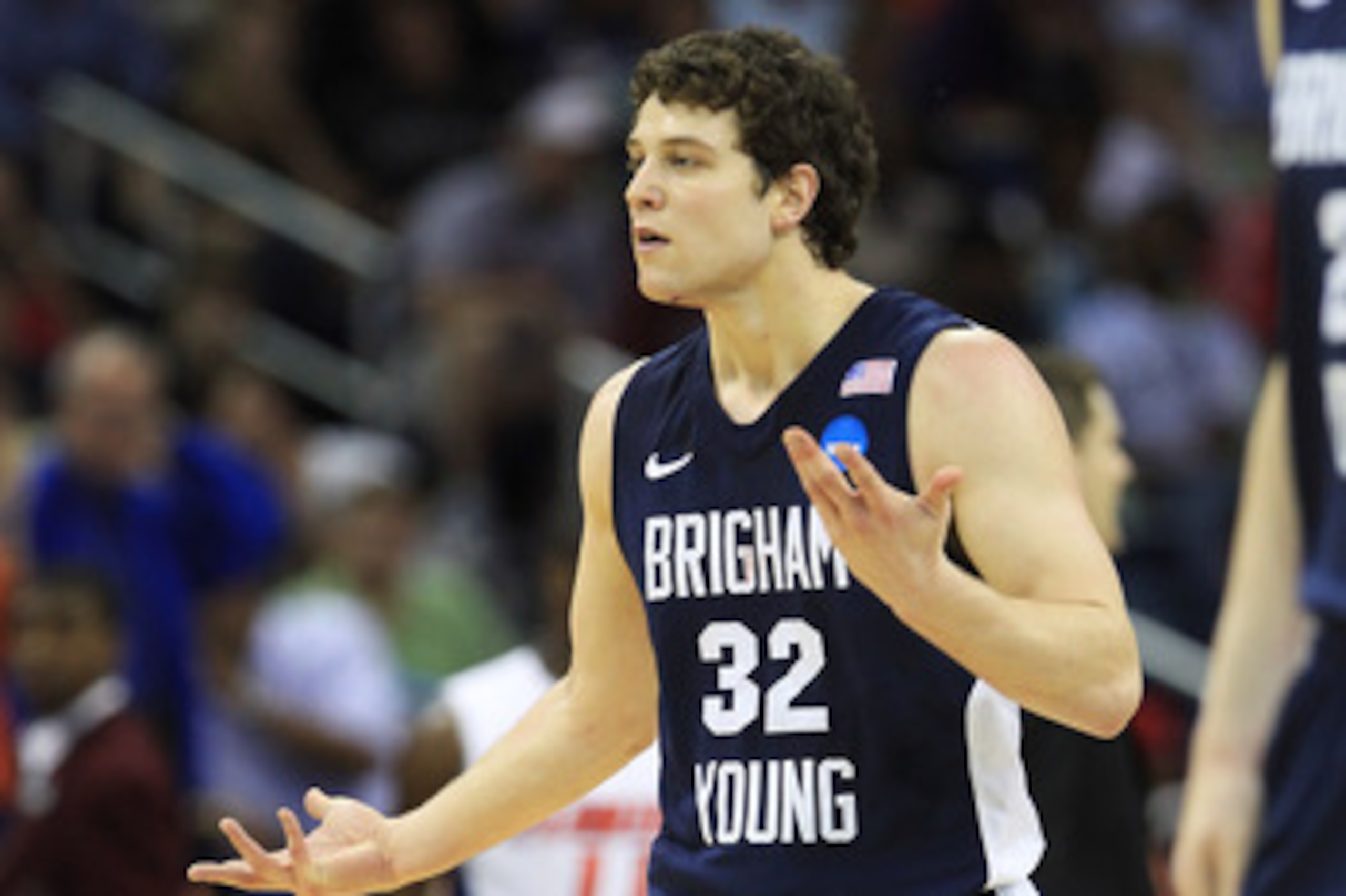 NEW ORLEANS, LA - MARCH 24:  Jimmer Fredette #32 of the Brigham Young Cougars reacts after being injured during their game against the Florida Gators in the Southeast regional of the 2011 NCAA men's basketball tournament at New Orleans Arena on March 24,