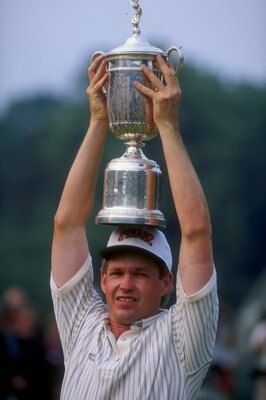 Lee Janzen of the USA holds the trophy over his head after winning the 1993 U.S. Open at the Batusrol Golf Club in Springfield, New Jersey.