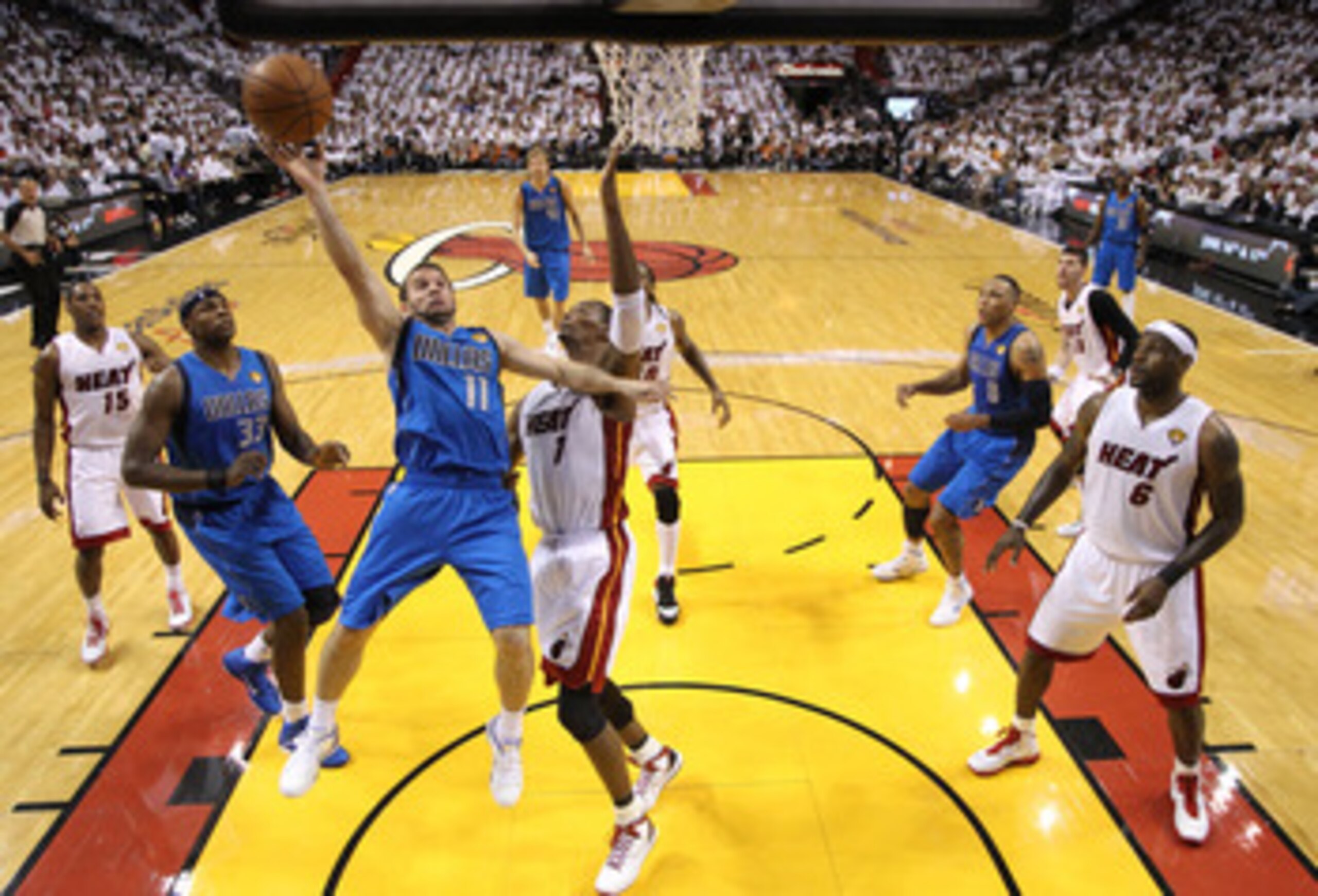 MIAMI, FL - JUNE 02:  Jose Juan Barea #11 of the Dallas Mavericks drives for a shot attempt against Chris Bosh #1 of the Miami Heat in Game Two of the 2011 NBA Finals at American Airlines Arena on June 2, 2011 in Miami, Florida. NOTE TO USER: User express