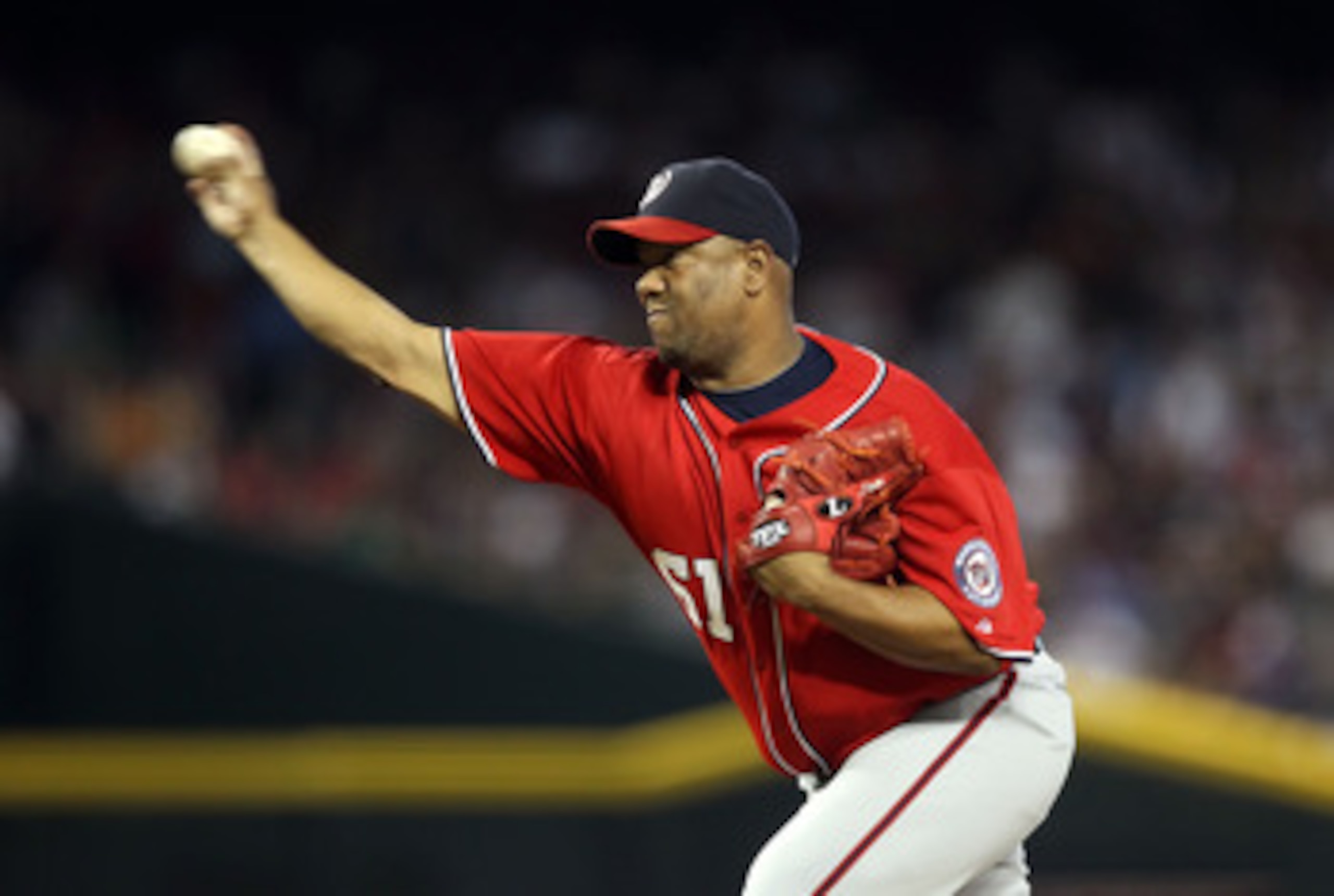 PHOENIX, AZ - JUNE 04: Starting pitcher Livan Hernandez #61 of the Washington Nationals pitches against the Arizona Diamondbacks during the Major League Baseball game at Chase Field on June 4, 2011 in Phoenix, Arizona. (Photo by Christian Petersen/Getty PHOENIX, AZ - JUNE 04: Starting pitcher Livan Hernandez #61 of the Washington Nationals pitches against the Arizona Diamondbacks during the Major League Baseball game at Chase Field on June 4, 2011 in Phoenix, Arizona. (Photo by Christian Petersen/Getty