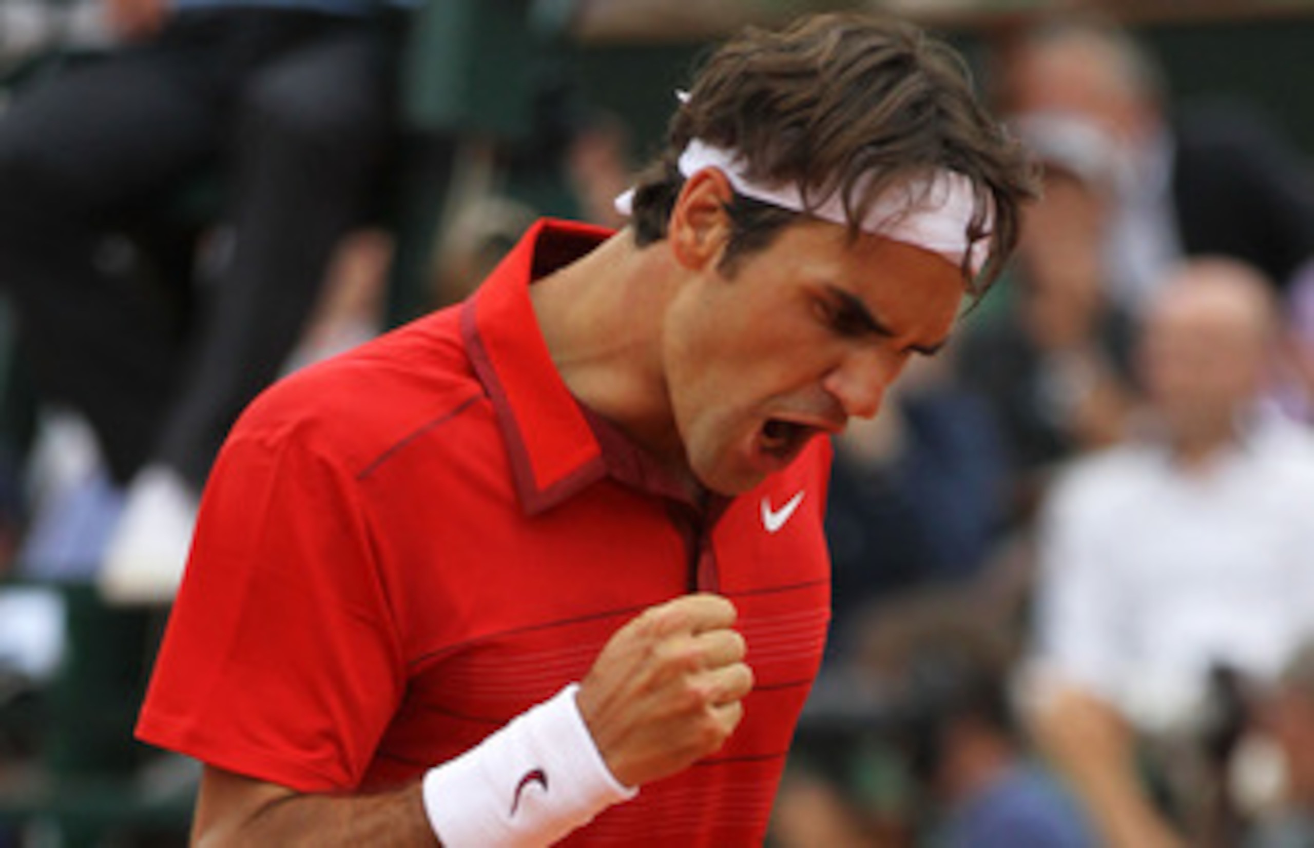 PARIS, FRANCE - JUNE 03:  Roger Federer of Switzerland celebrates a point during the men's singles semi final match between Roger Federer of Switzerland and Novak Djokovic of Serbia on day thirteen of the French Open at Roland Garros on June 3, 2011 in Pa