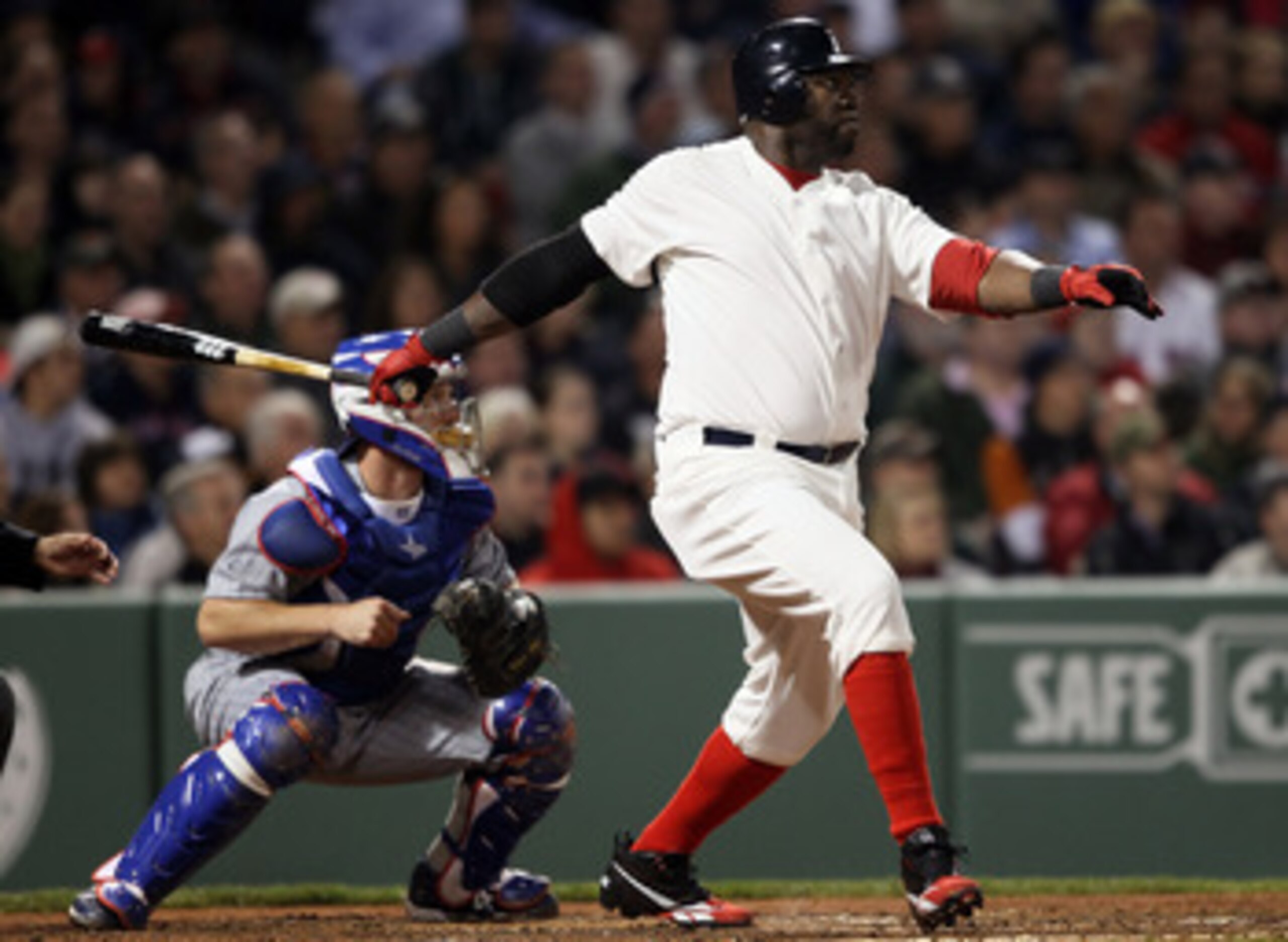 BOSTON, MA - MAY 21: David Ortiz #34 of the Boston Red Sox hits a two run homer in the fourth inning as Koyie Hill #55 of the Chicago Cubs catches on May 21, 2011 at Fenway Park in Boston, Massachusetts. Tonight the Chicago Cubs and the Boston Red Sox ar BOSTON, MA - MAY 21: David Ortiz #34 of the Boston Red Sox hits a two run homer in the fourth inning as Koyie Hill #55 of the Chicago Cubs catches on May 21, 2011 at Fenway Park in Boston, Massachusetts. Tonight the Chicago Cubs and the Boston Red Sox ar