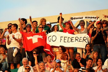 PARIS, FRANCE - JUNE 03:  Roger Federer fans cheer on their player during the men's singles semi final match between Roger Federer of Switzerland and Novak Djokovic of Serbia on day thirteen of the French Open at Roland Garros on June 3, 2011 in Paris, Fr