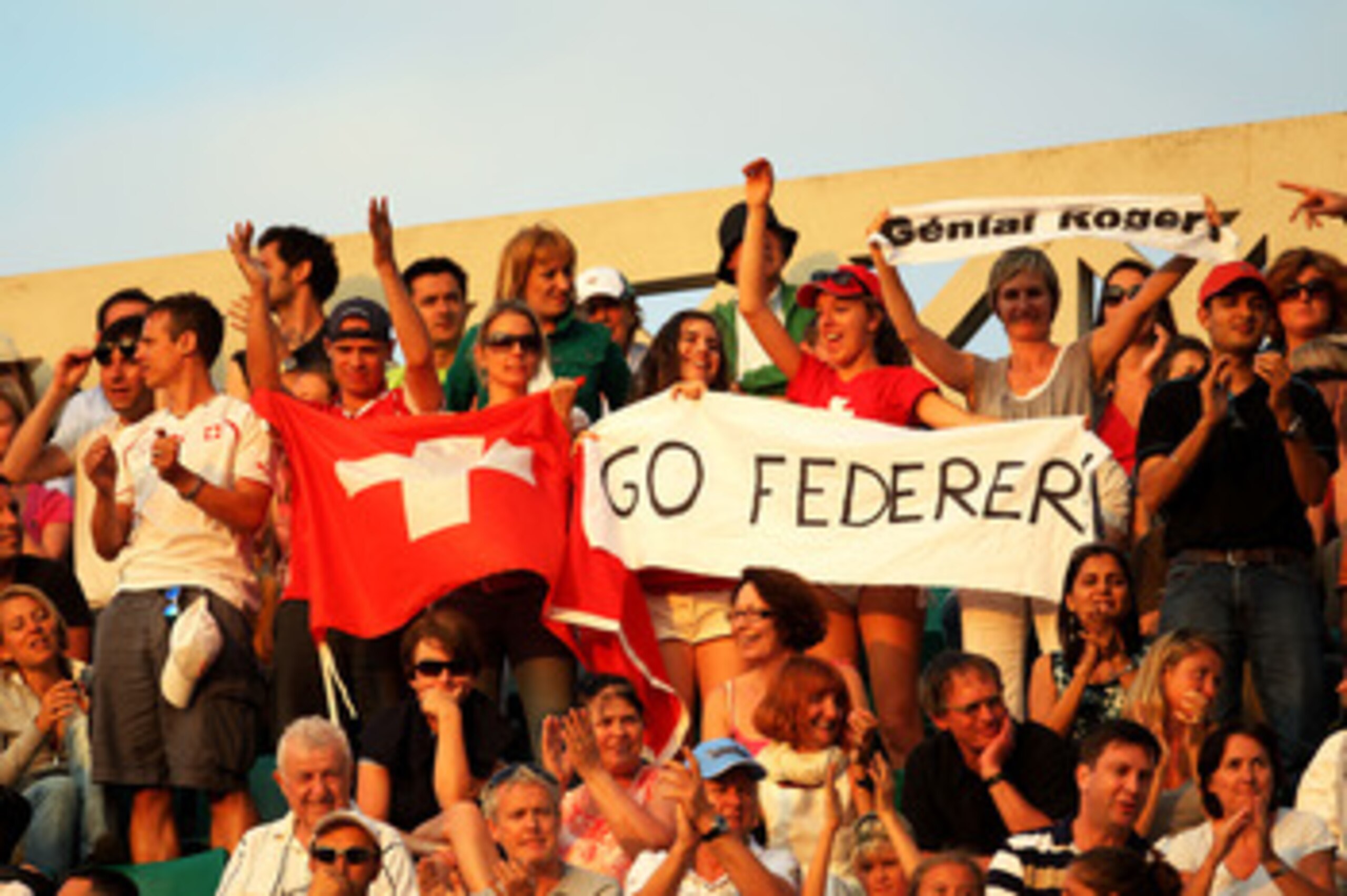 PARIS, FRANCE - JUNE 03:  Roger Federer fans cheer on their player during the men's singles semi final match between Roger Federer of Switzerland and Novak Djokovic of Serbia on day thirteen of the French Open at Roland Garros on June 3, 2011 in Paris, Fr
