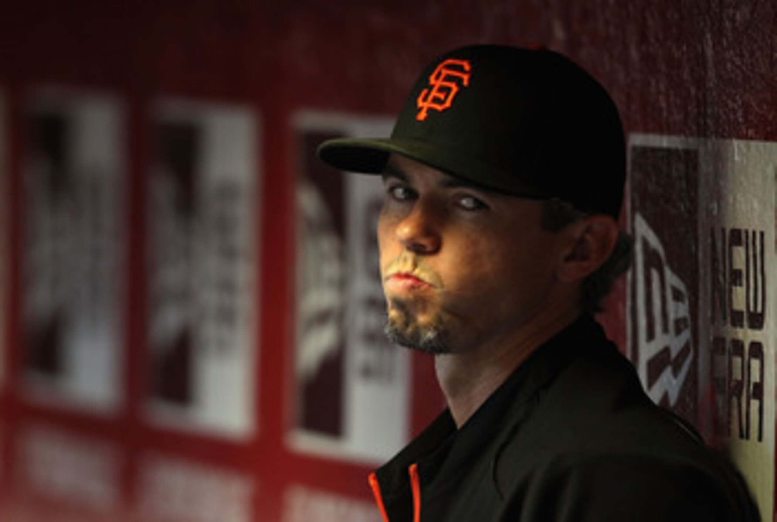 PHOENIX, AZ - APRIL 16:  Eli Whiteside #22 of the San Francisco Giants watches from the dugout during the Major League Baseball game against the Arizona Diamondbacks at Chase Field on April 16, 2011 in Phoenix, Arizona.  The Giants defeated the Diamondbac