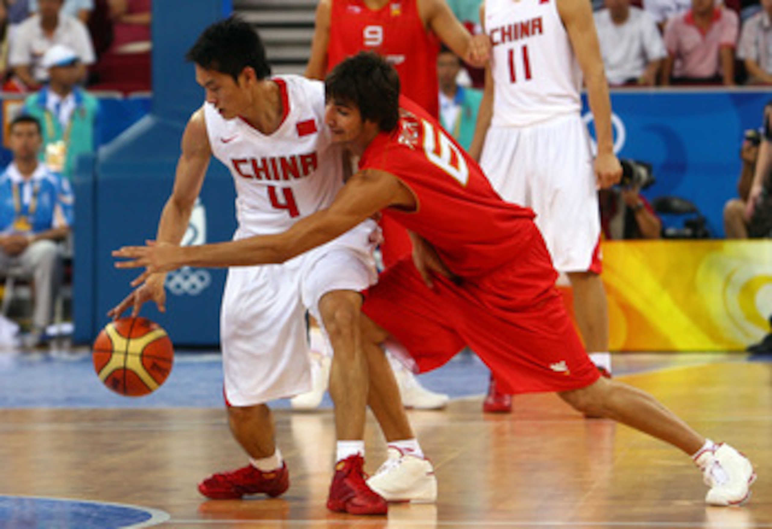 BEIJING - AUGUST 12: (R-L) Ricky Rubio #6 of Spain attempts to steal the ball from Chen Jianghua #4 of China in the preliminary basketball game held at the Beijing Olympic Basketball Gymnasium during Day 4 of the Beijing 2008 Olympic Games on August 12, BEIJING - AUGUST 12: (R-L) Ricky Rubio #6 of Spain attempts to steal the ball from Chen Jianghua #4 of China in the preliminary basketball game held at the Beijing Olympic Basketball Gymnasium during Day 4 of the Beijing 2008 Olympic Games on August 12,