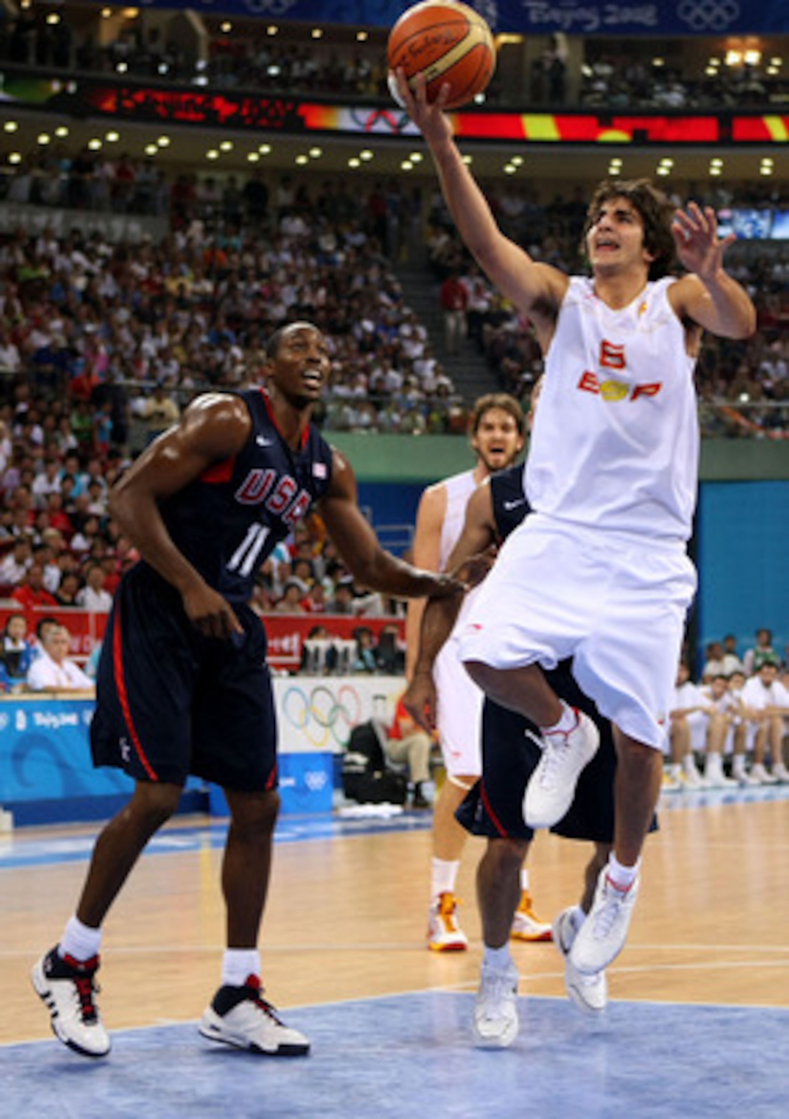 BEIJING - AUGUST 24: Ricky Rubio #6 of Spain lays the ball up past Dwight Howard #11 of the United States in the gold medal game during Day 16 of the Beijing 2008 Olympic Games at the Beijing Olympic Basketball Gymnasium on August 24, 2008 in Beijing, Ch BEIJING - AUGUST 24: Ricky Rubio #6 of Spain lays the ball up past Dwight Howard #11 of the United States in the gold medal game during Day 16 of the Beijing 2008 Olympic Games at the Beijing Olympic Basketball Gymnasium on August 24, 2008 in Beijing, Ch