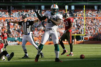 MIAMI GARDENS, FL - NOVEMBER 15:   Cornerback Vontae Davis #21 of the Miami Dolphins celebrates after breaking up a pass intended for wide receiver Maurice Stovall #85 of the Tampa Bay Buccaneers at Land Shark Stadium on November 15, 2009 in Miami Gardens