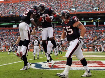 MIAMI - DECEMBER 27:  Wide receivers Andre Johnson #80 and Jacoby Jones #12 of the Houston Texans after Johnson scored a touchdown against the Miami Dolphins at Land Shark Stadium on December 27, 2009 in Miami, Florida. The Texans defeated the Dolphins 27