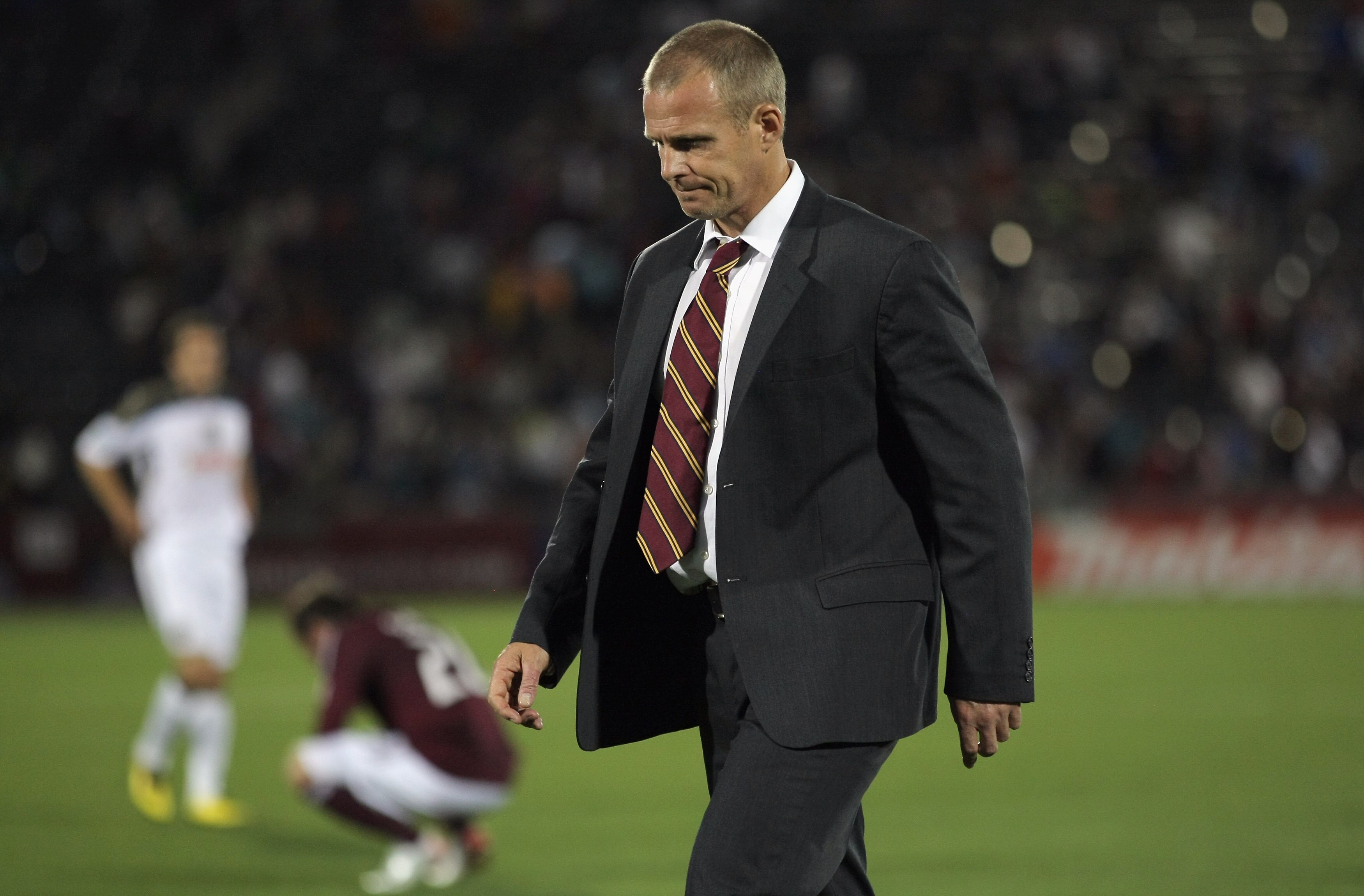 COMMERCE CITY, CO - JUNE 04:  Head coach Gary Smith of the Colorado Rapids leaves the field after the Rapids played to a 1-1 draw with the Philadelphia Union at Dick's Sporting Goods Park on June 4, 2011 in Commerce City, Colorado.  (Photo by Doug Pensing