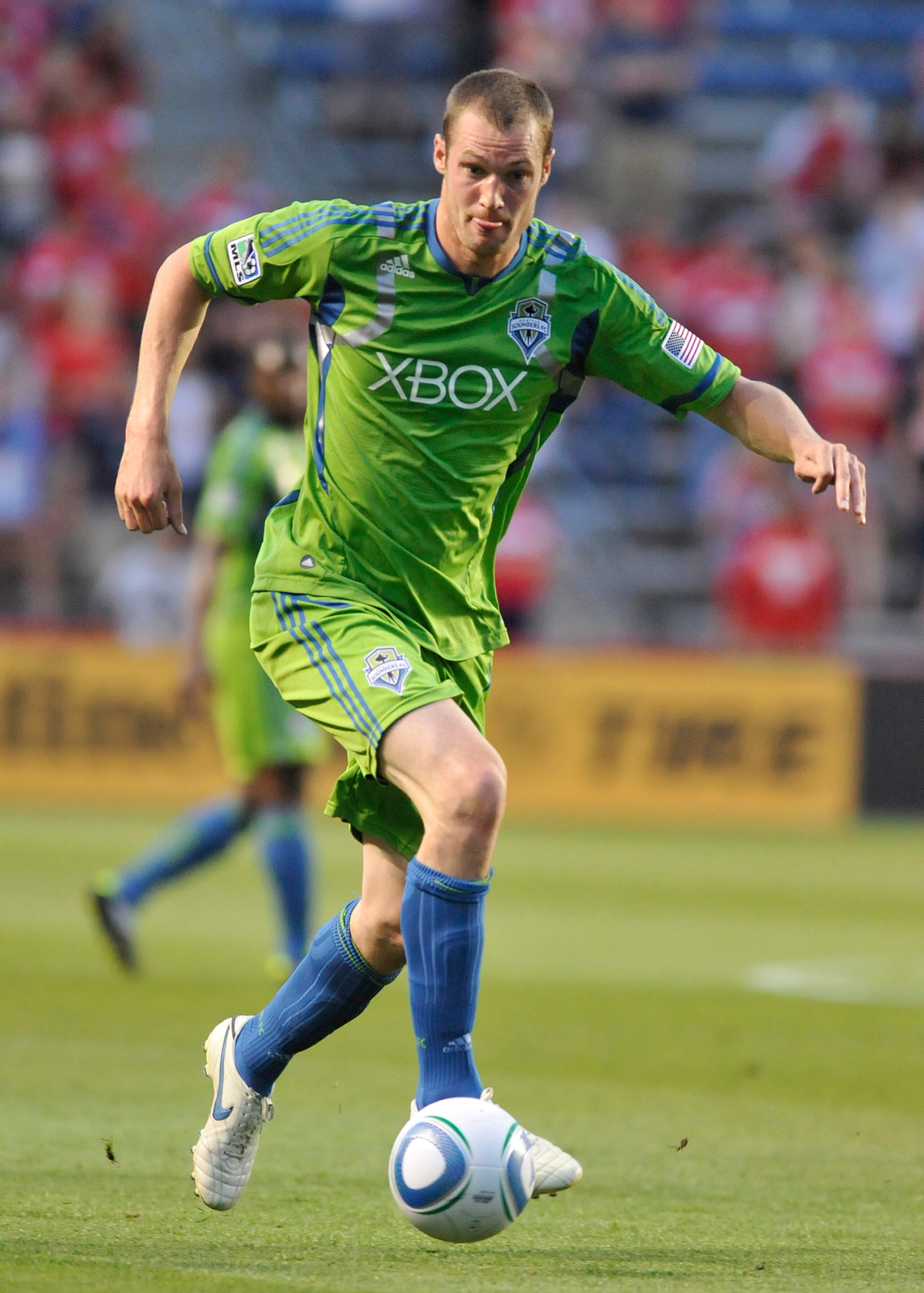BRIDGEVIEW, IL - JUNE 4: Nate Jaqua #21 of the Seattle Sounders moves the ball forward against the Chicago Fire in an MLS match on June 4, 2011 at Toyota Park in Bridgeview, Illinois. The Fire and the Sounders game ended in a 0-0 tie.  (Photo by David Ban